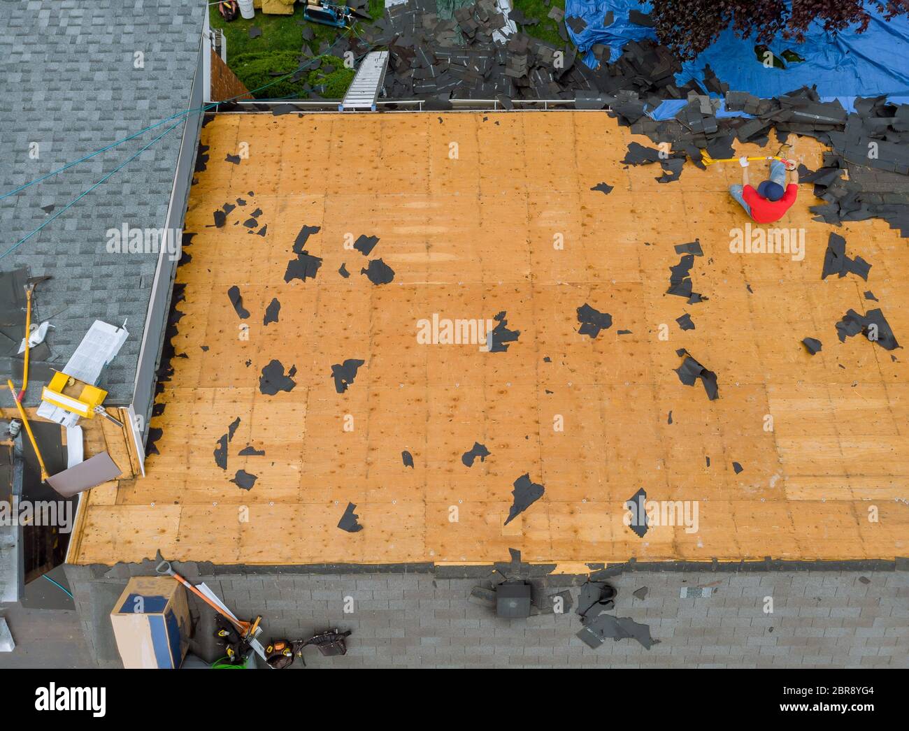 Removal of old roof and replacement with all new shingle being applied