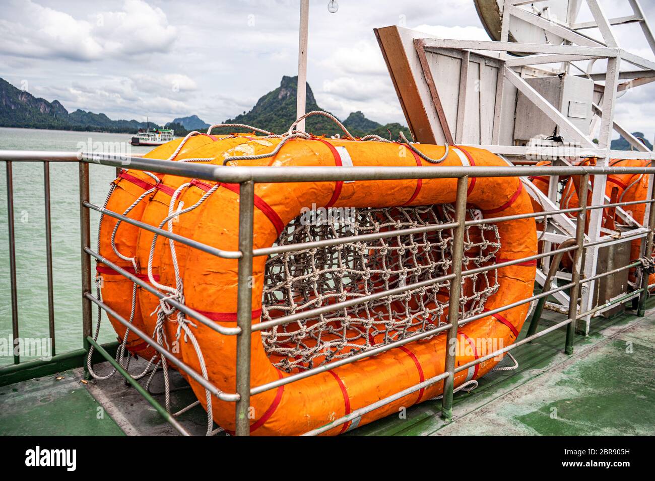 Orange life raft. mesh at the bottom of the raft. Thailand's warm sea