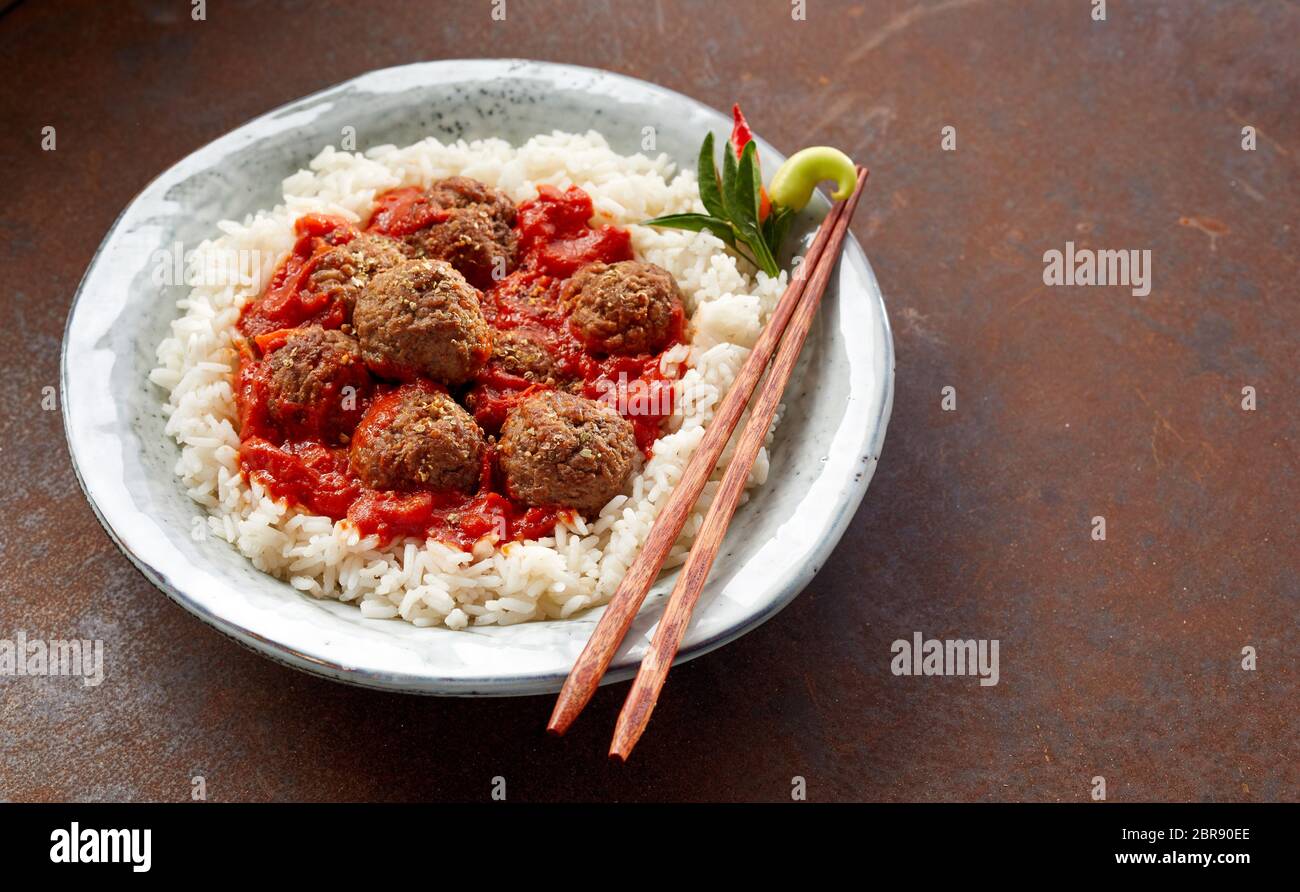 Overhead view on individual bowl of fried white rice with spicy ...
