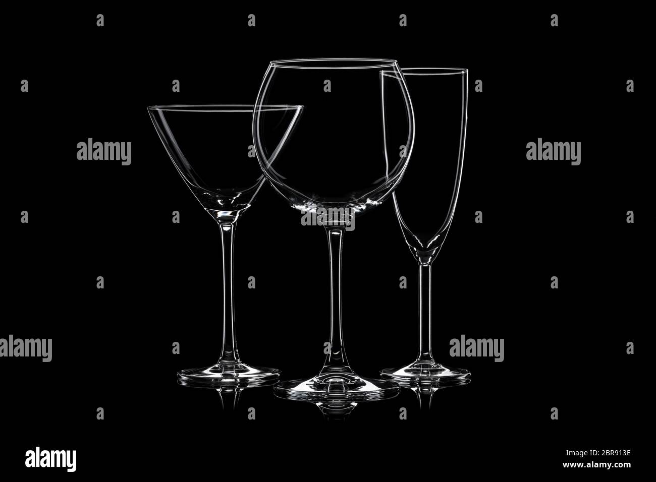 Empty cocktail glassware on a black background. Stock Photo