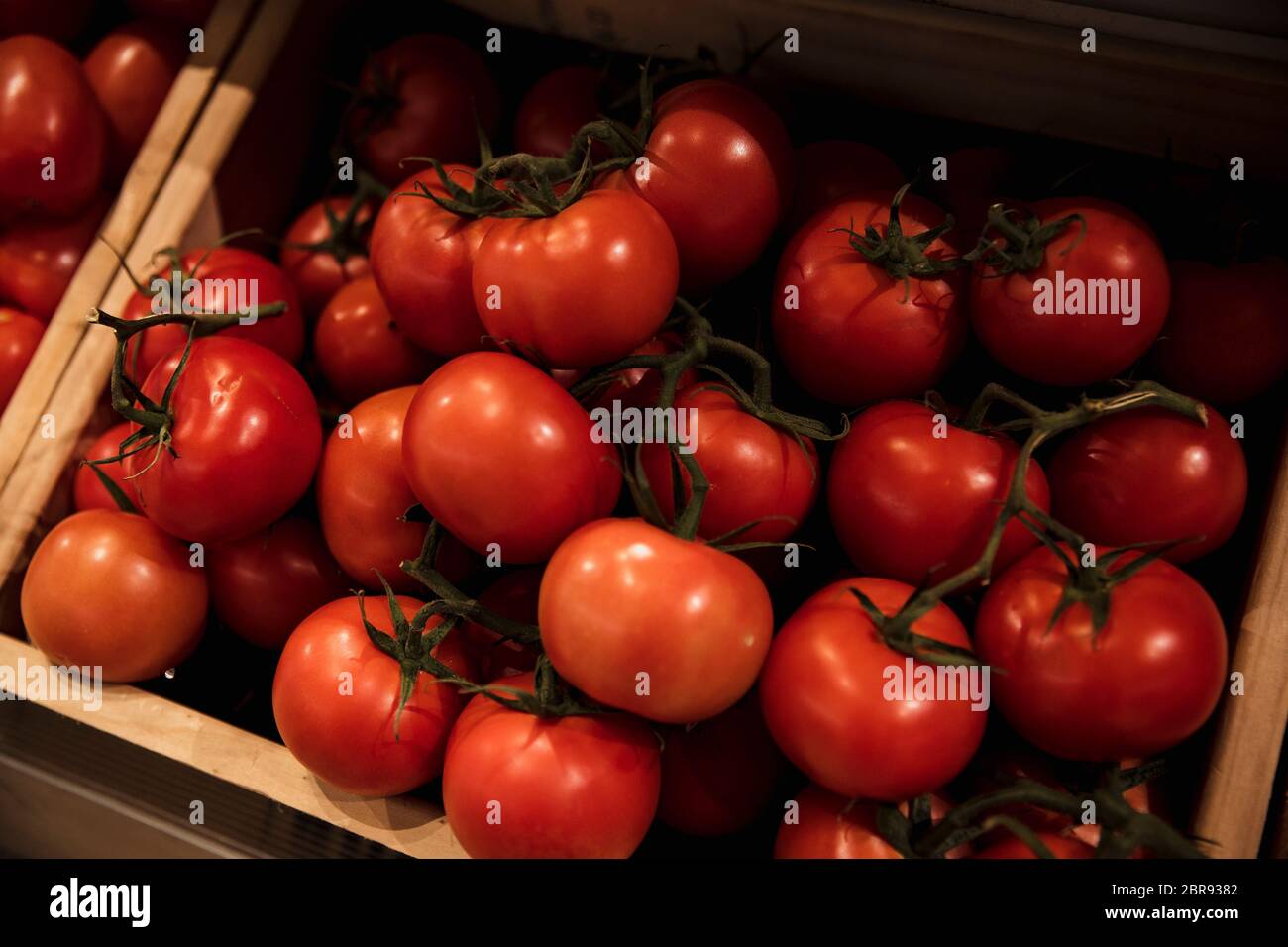 A close-up shot of an abundance of fresh Red Tomatoes on display at a ...