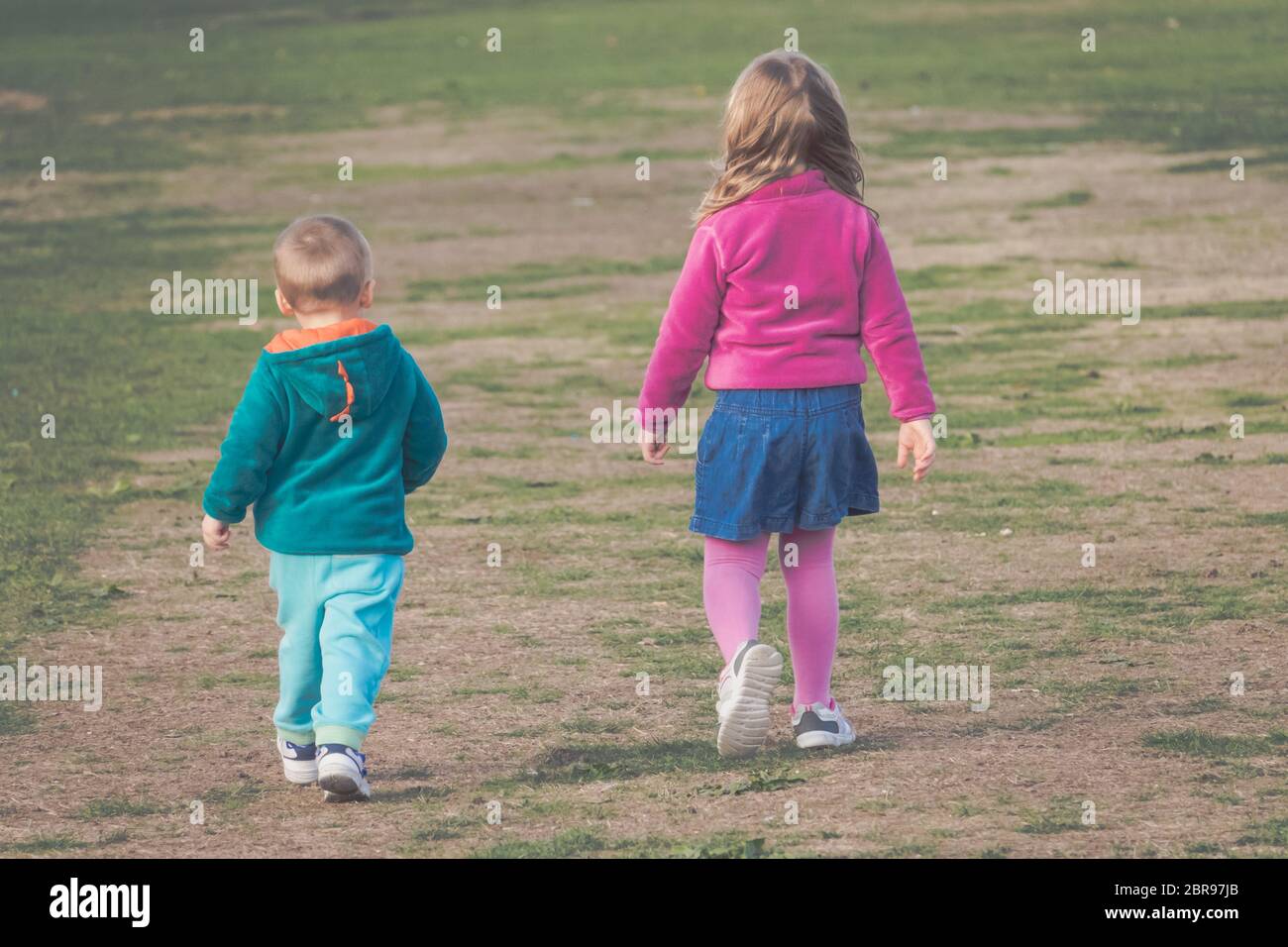 Brother and sister walking together in the countryside in autumn Stock ...