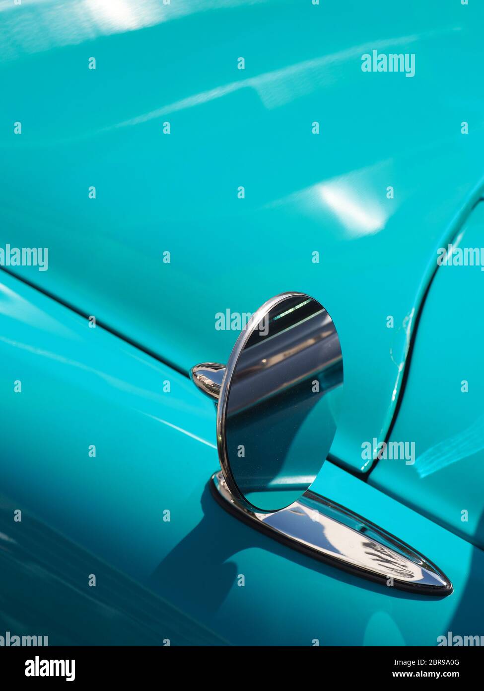 Sideview mirror of an old vintage car, conceptual vintage background