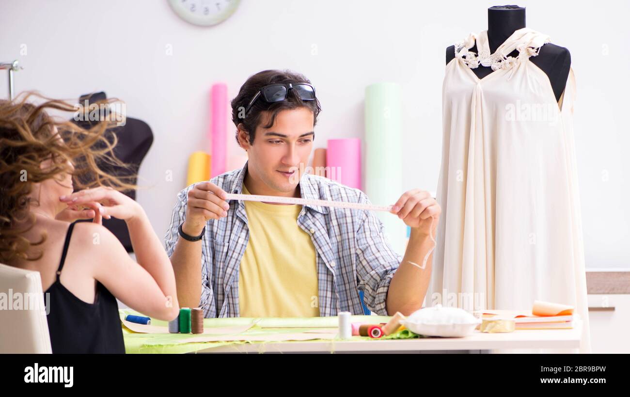 The young tailor working in his workshop Stock Photo - Alamy