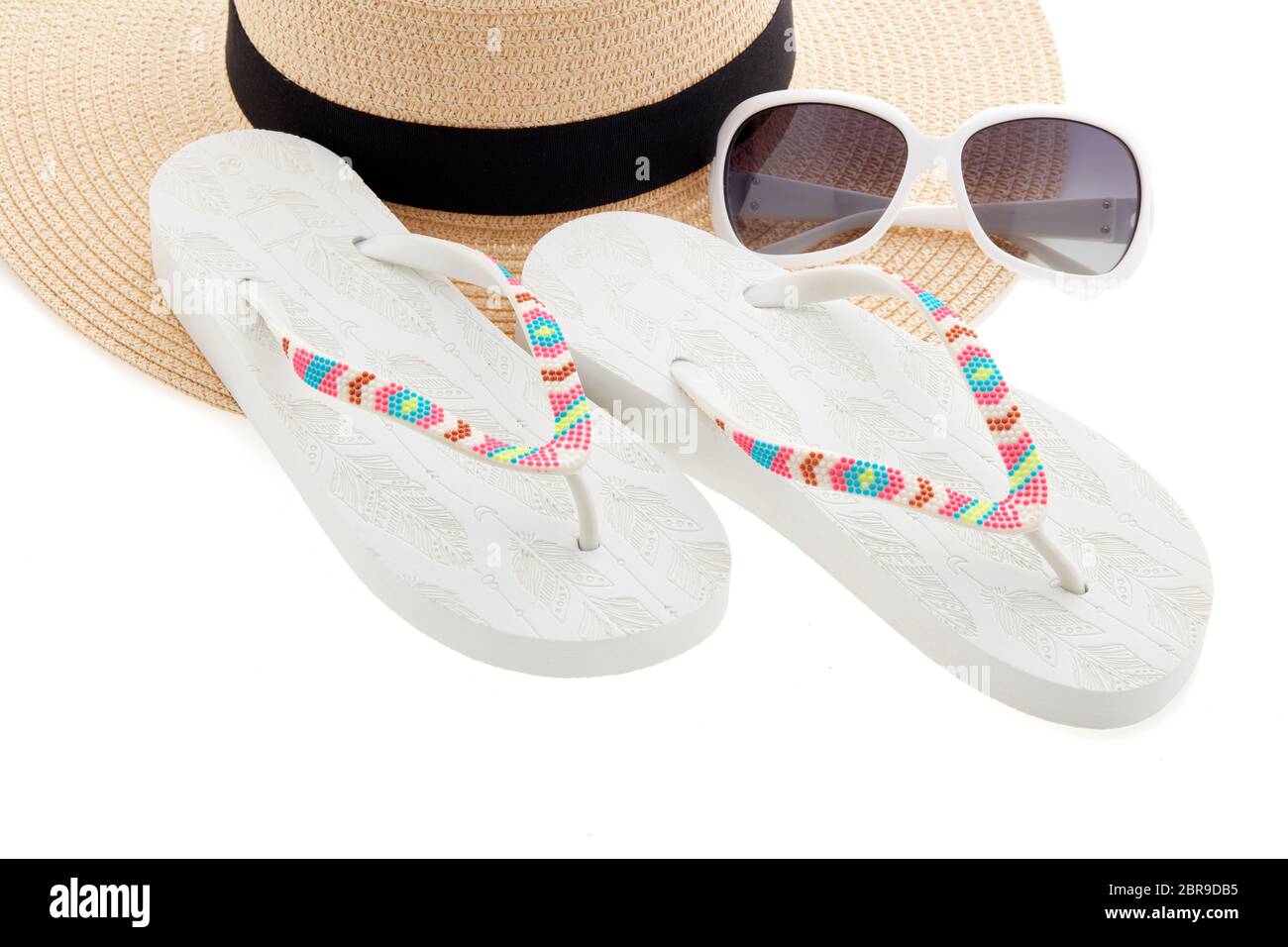 Beach accessories: white female flip flops and sunglasses isolated on ...