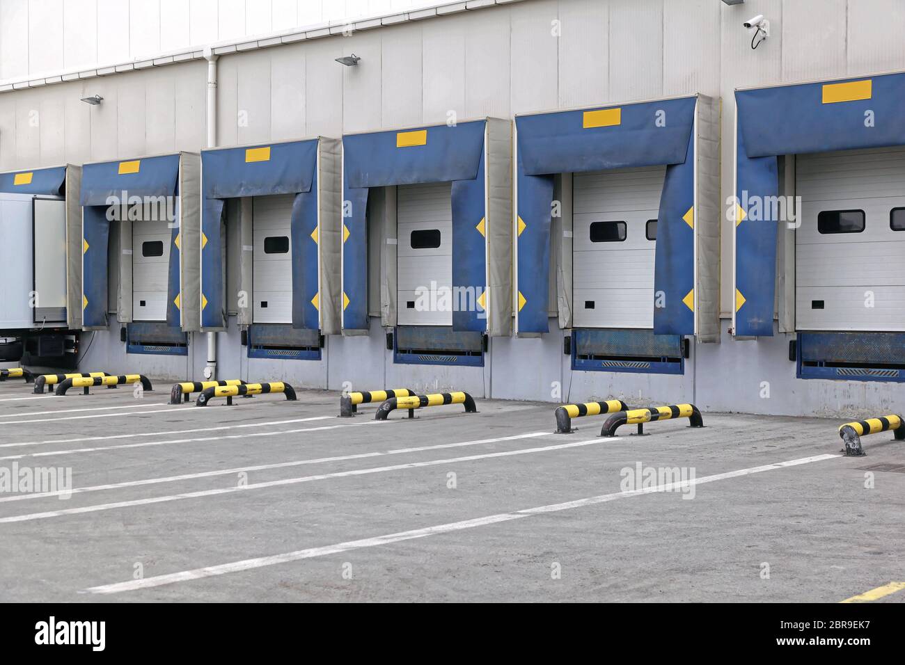 Loading Ramp Cargo Doors at Distribution Center Warehouse Stock Photo