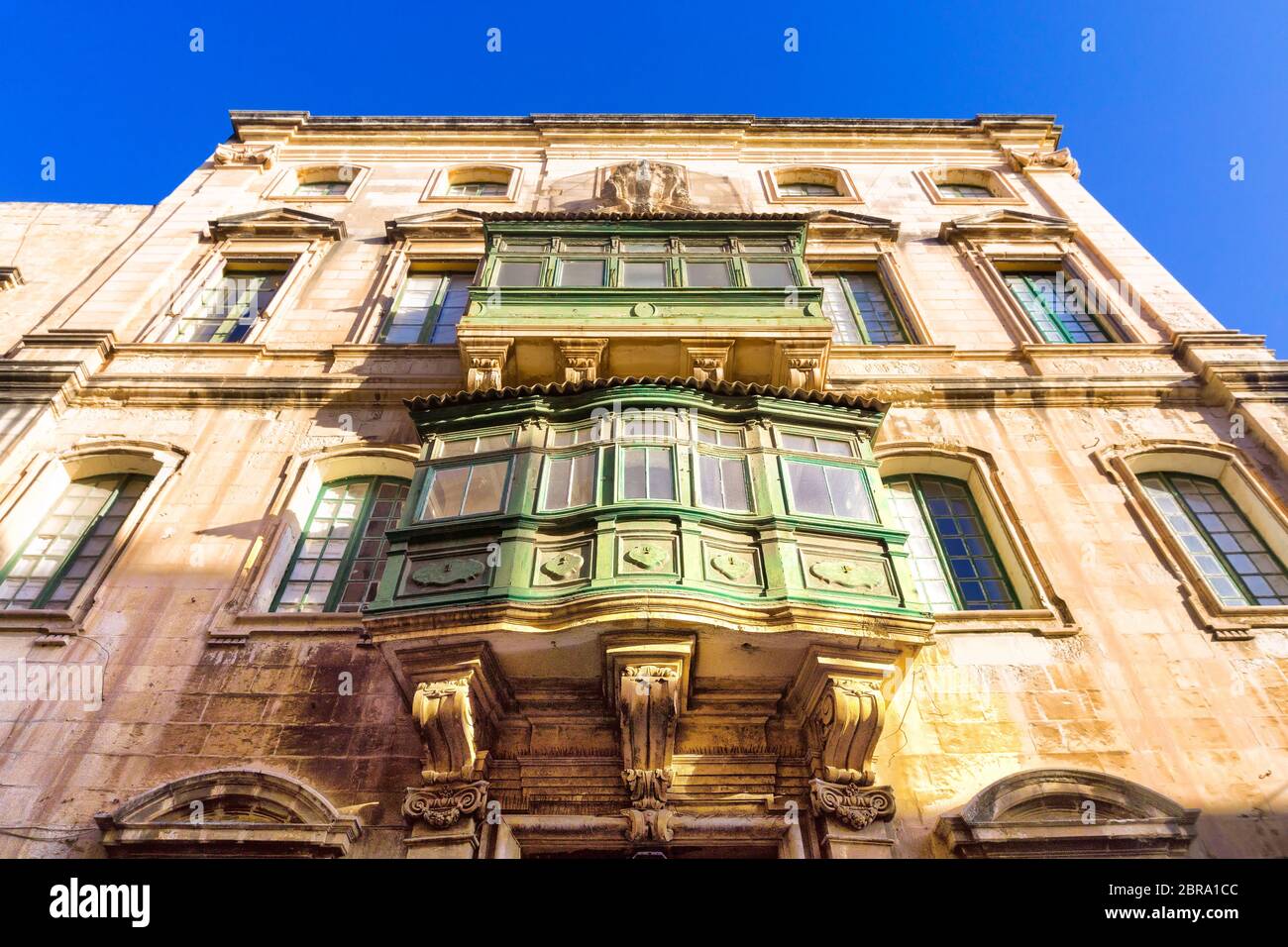 Golden light on the buildings in Valletta, Malta Stock Photo