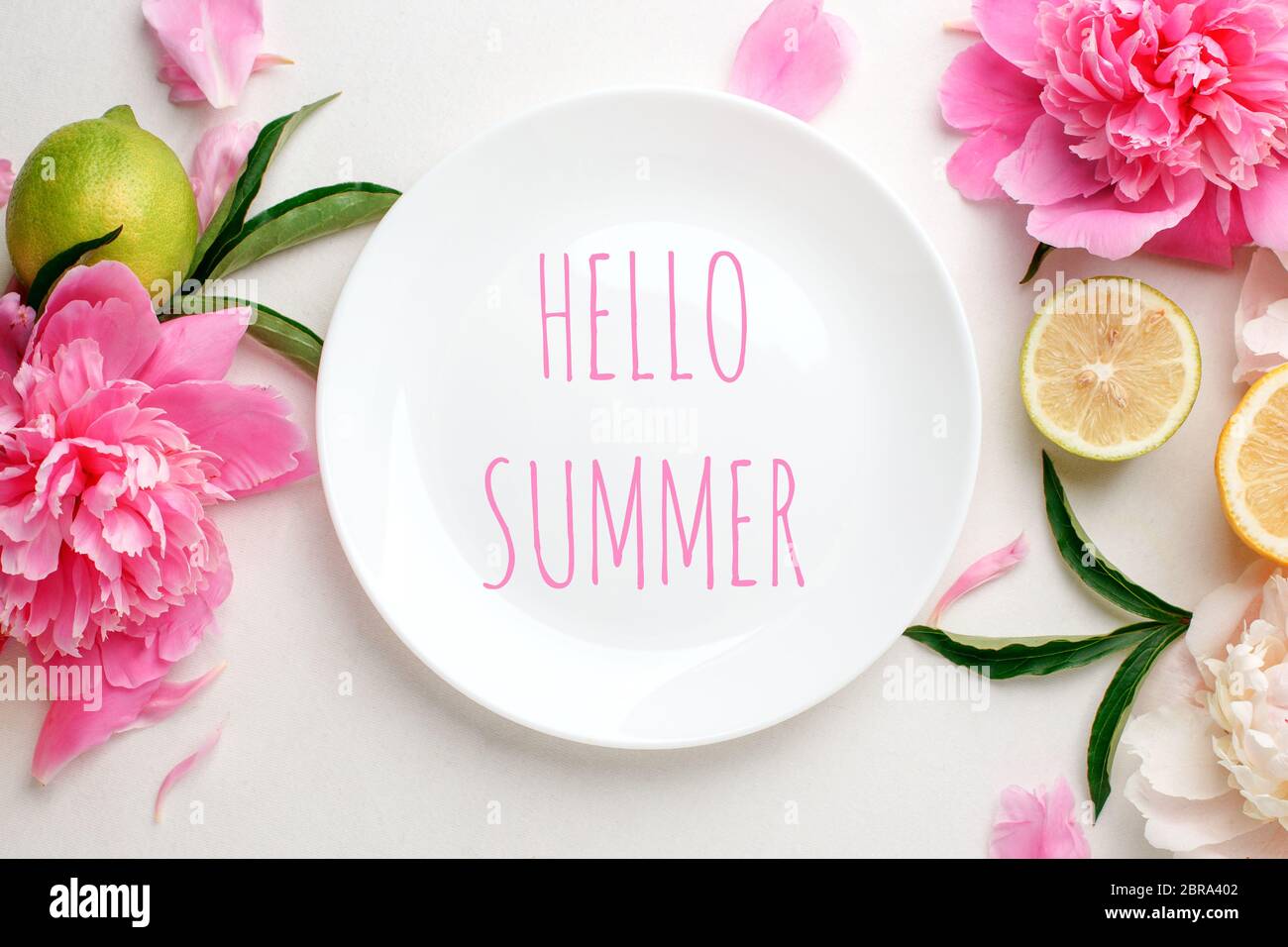 Top view of white empty plate over spring flowers. Flat lay, spring ...