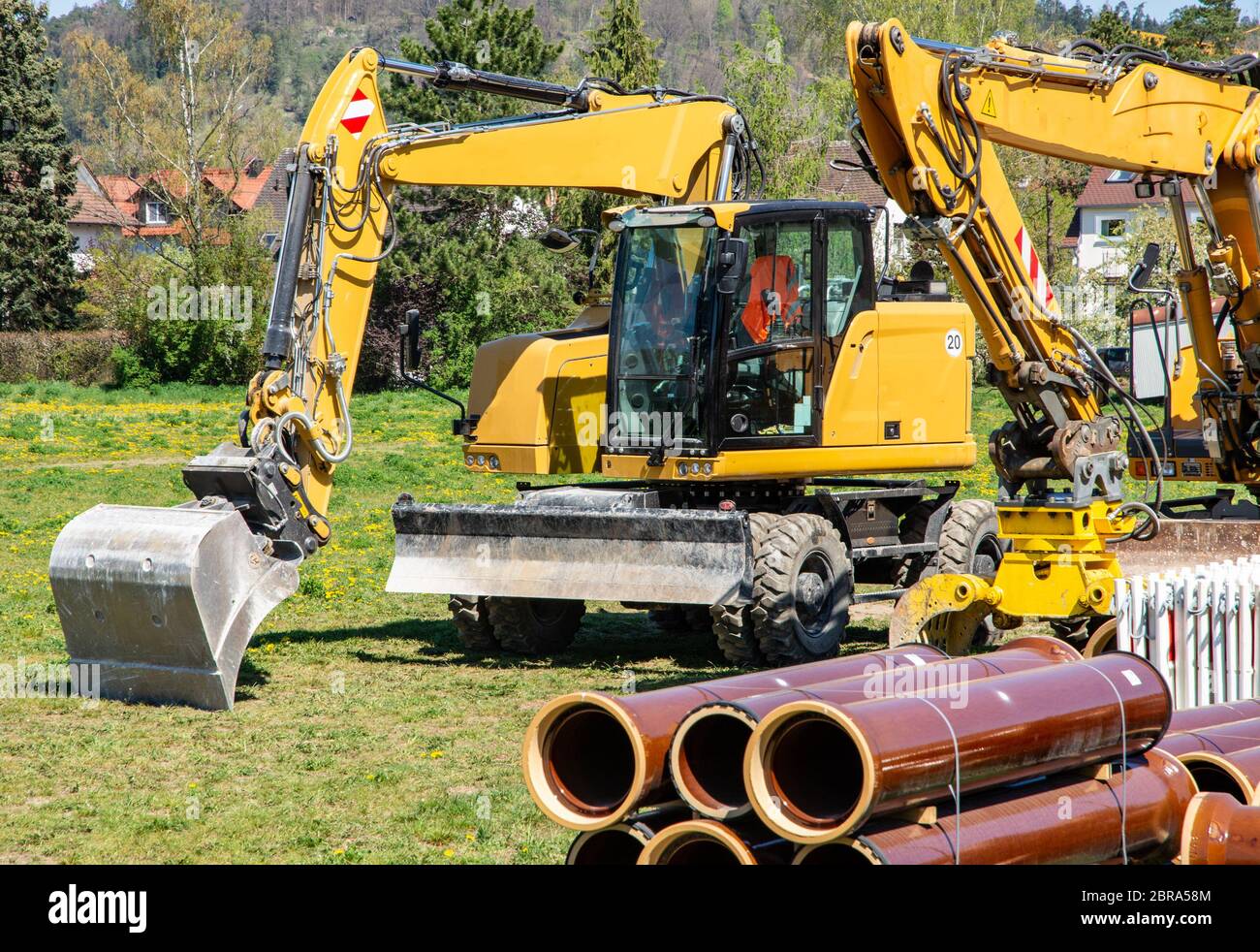 Construction site with yellow excavators Stock Photo - Alamy
