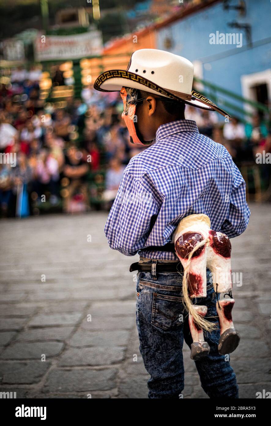 A boy waits for his part in a play on San Roque Plaza in the city of Guanajuato, Mexico. Stock Photo