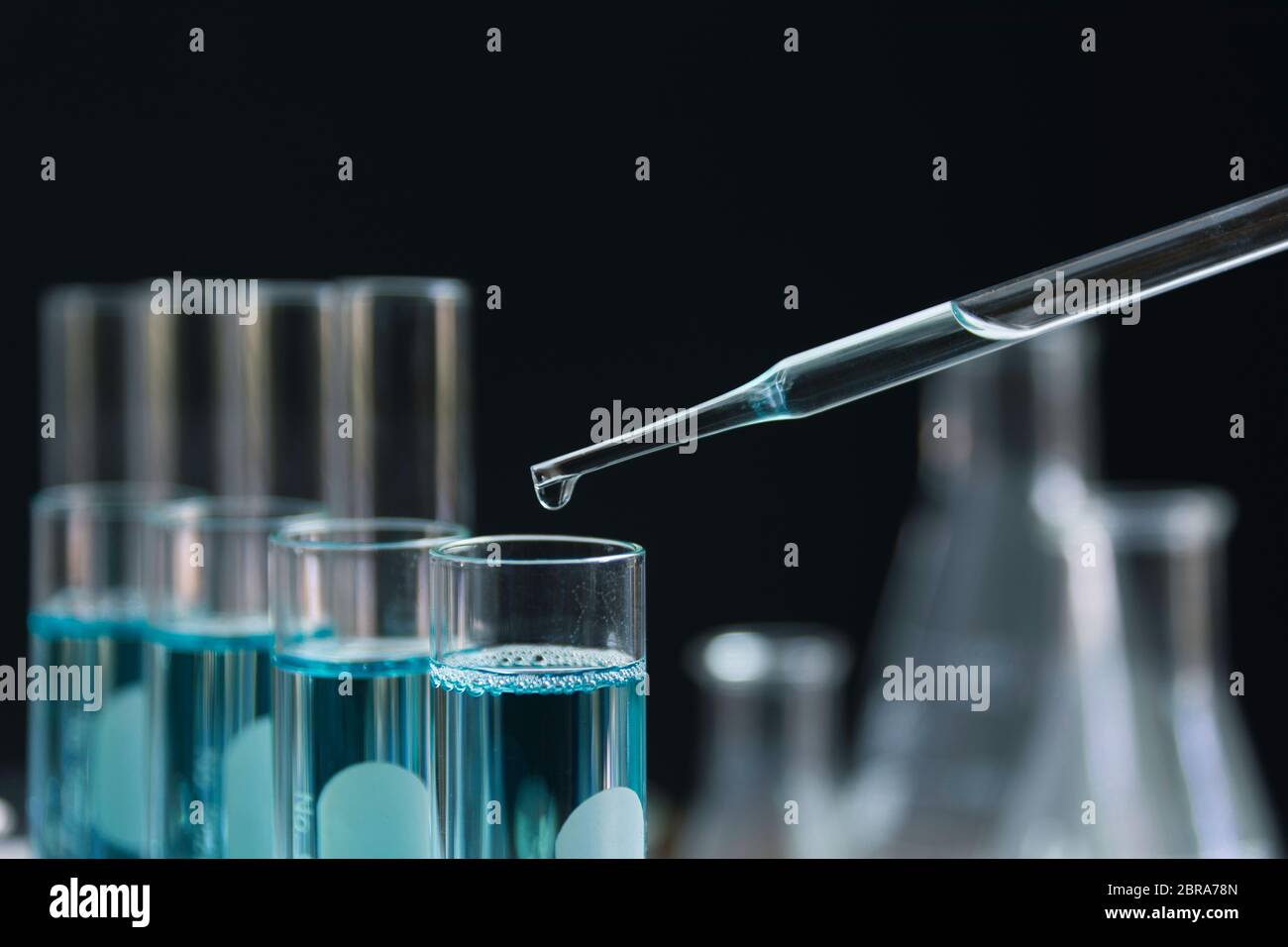 Glass laboratory chemical test tubes with liquid for analytical ...