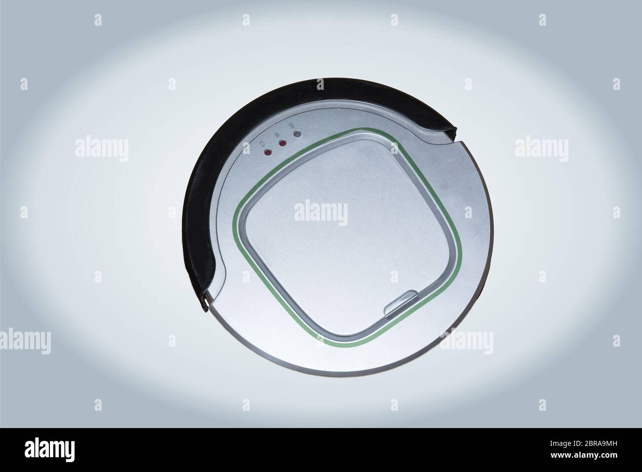 Robotic vacuum cleaner isolated on silver background Stock Photo