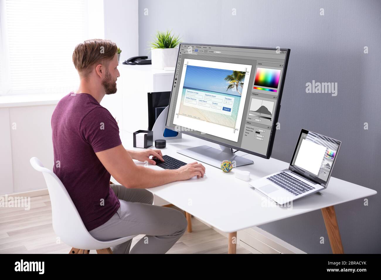Designer Editing Photo On Computer In Office Stock Photo