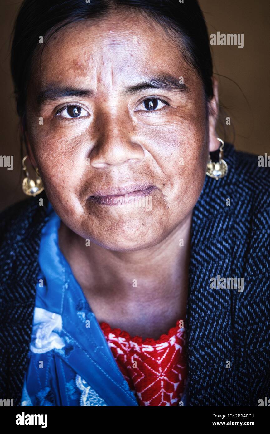 Portrait of an artisan who hand sews traditional blouses in San Vicente Coatlan, Oaxaca, Mexico. Stock Photo