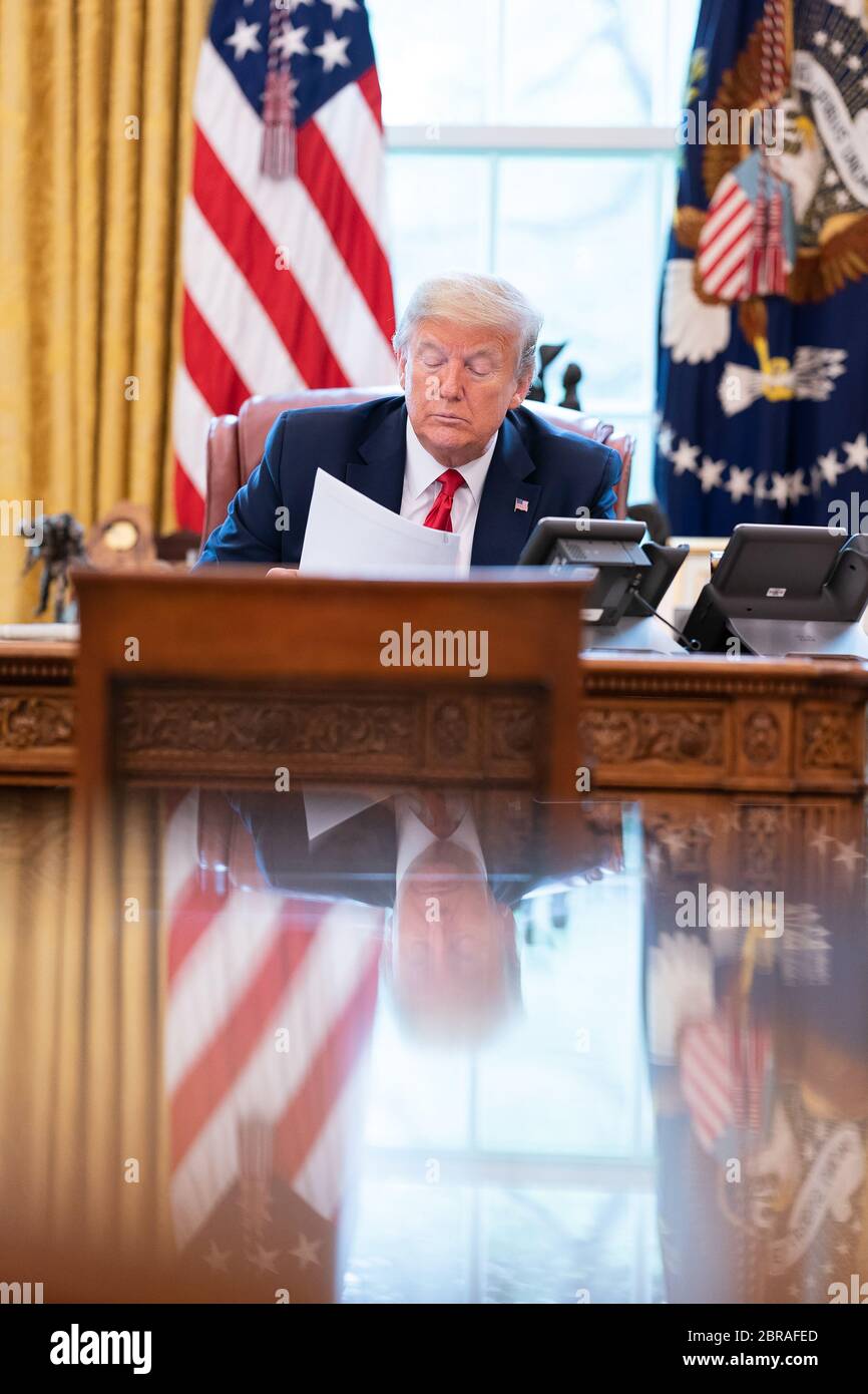 President Donald J. Trump talks on the speaker phone with Mexico’s President Andres Manuel Lopez Obrador Friday, April 17, 2020, in the Oval Office of the White House. (USA) Stock Photo