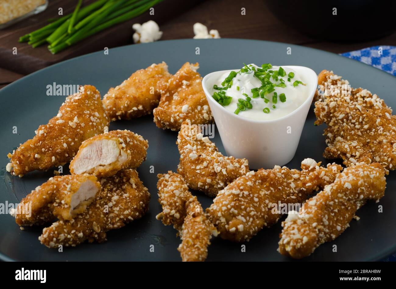 Chicken strips in popcorn breadcrumbs, with delicious garlic dip and