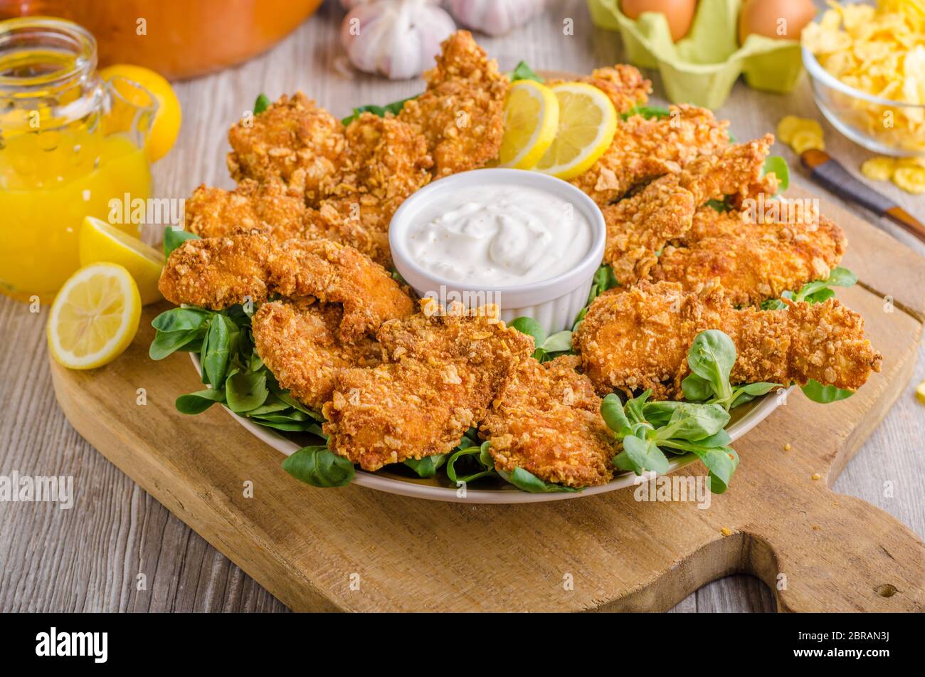Chicken strips with delish garlic dip, food photography Stock Photo Alamy