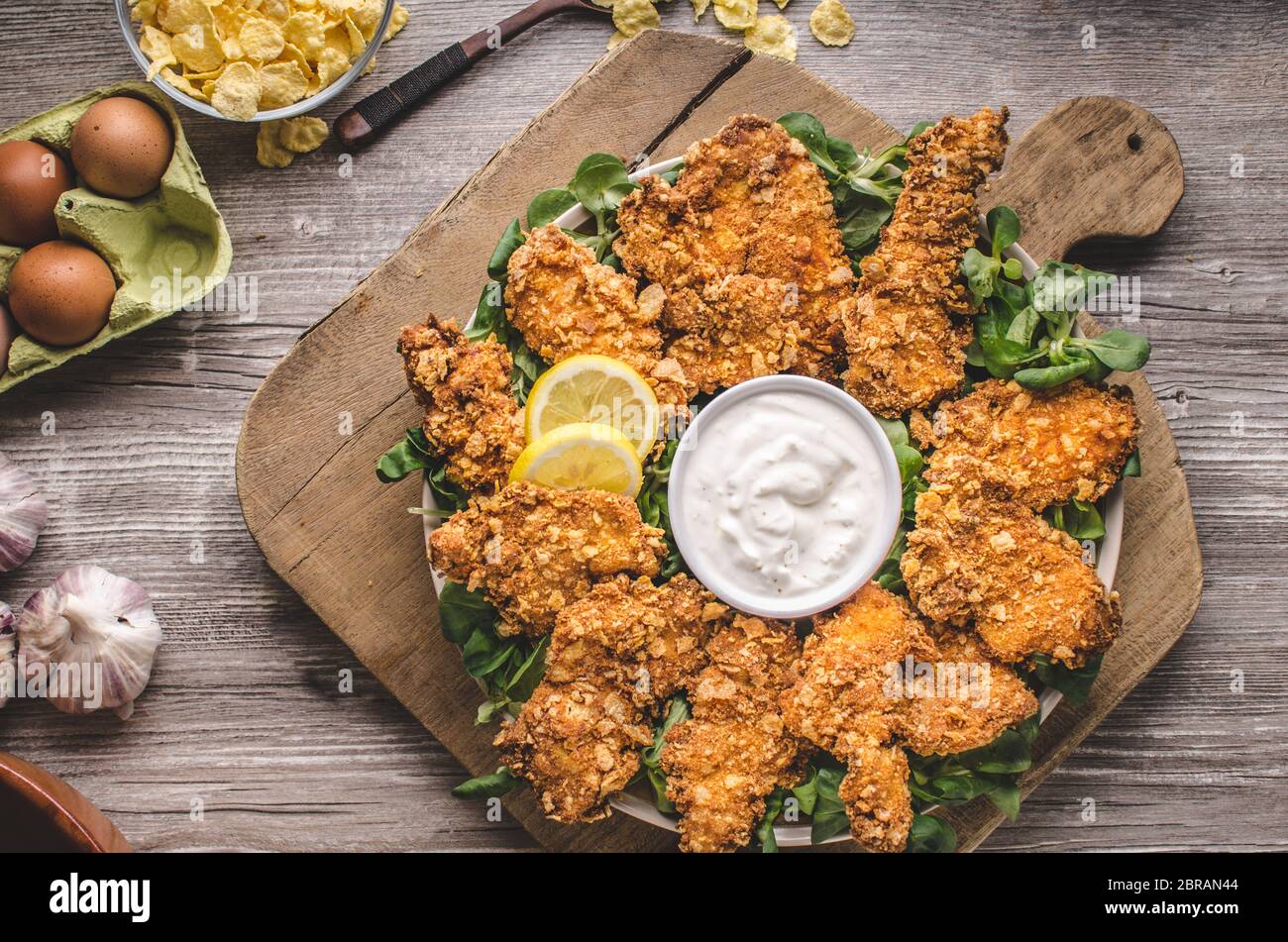 Chicken strips with delish garlic dip, food photography Stock Photo Alamy