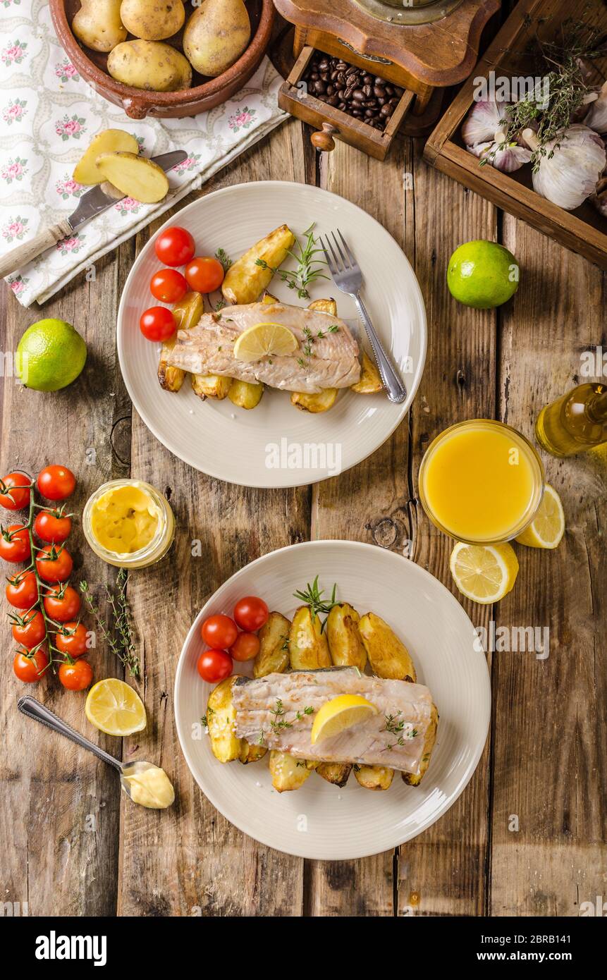 Baked rainbow trout with roasted potatoes and homemade mayonnaise Stock
