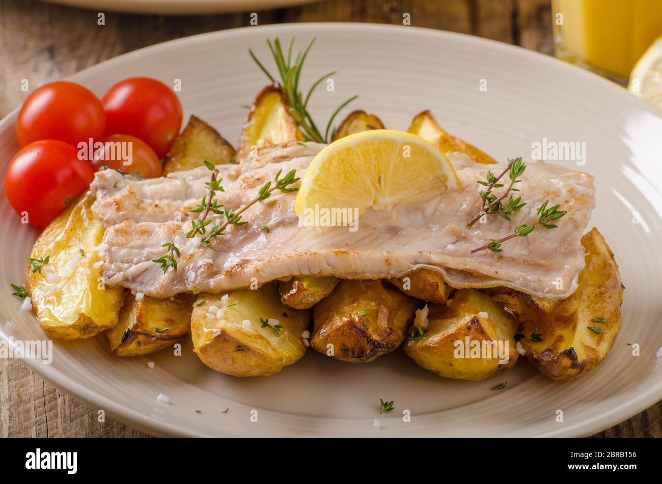 Baked rainbow trout with roasted potatoes and homemade mayonnaise Stock