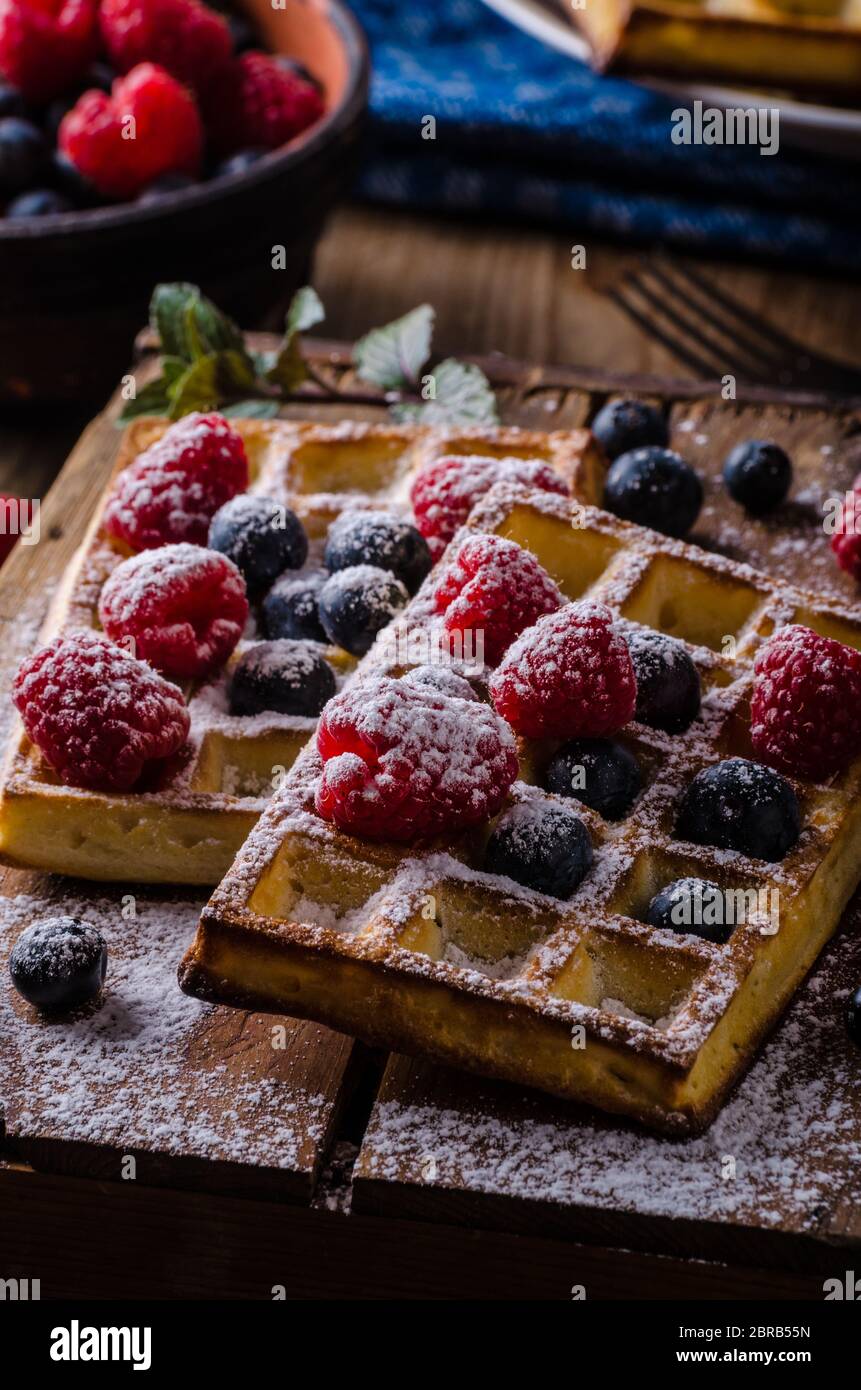 Waffles with berries - blueberries, raspberries, topped with sugar ...