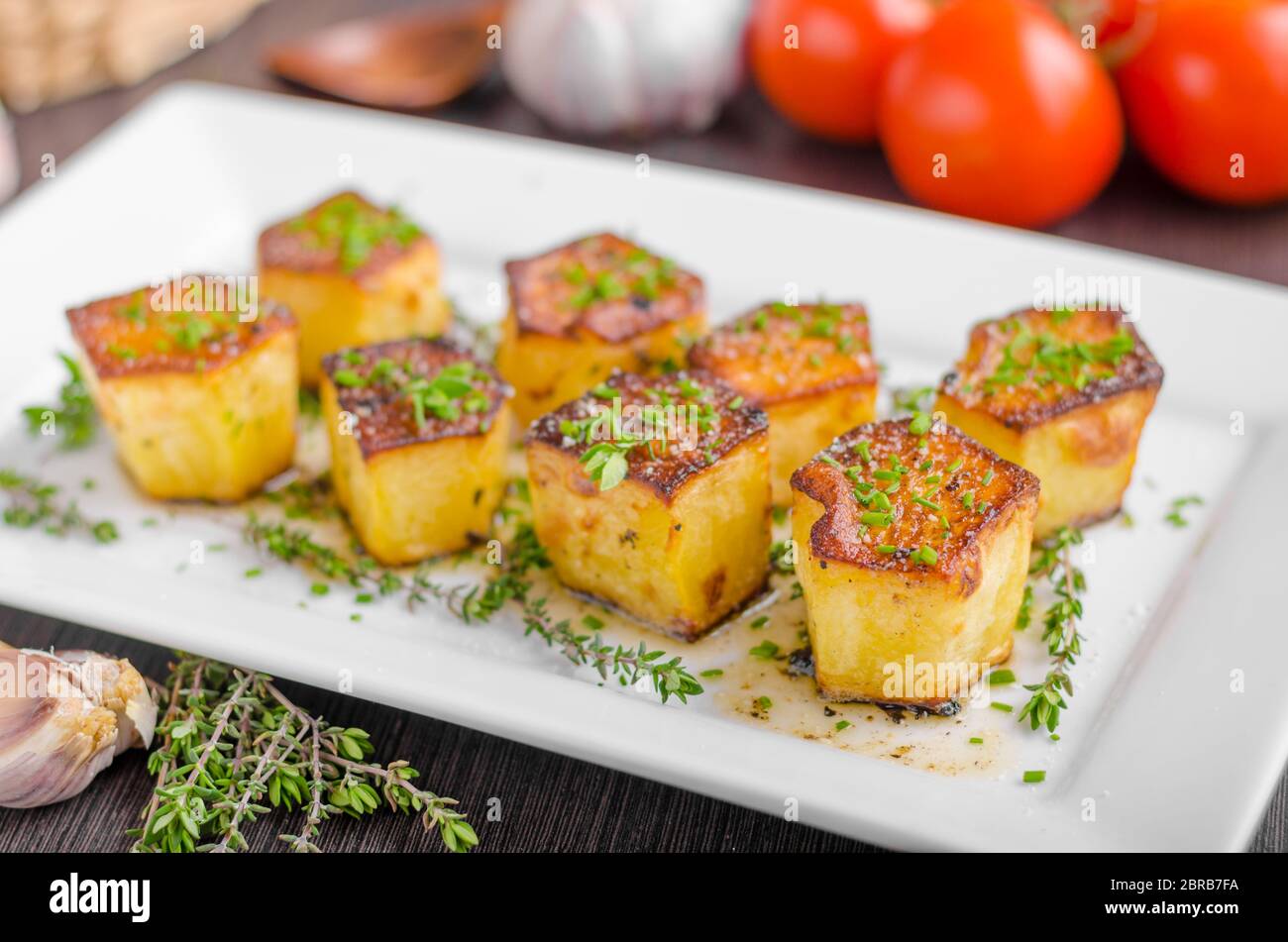 Potato fondant with garlic and herbs, delish simple meal Stock Photo