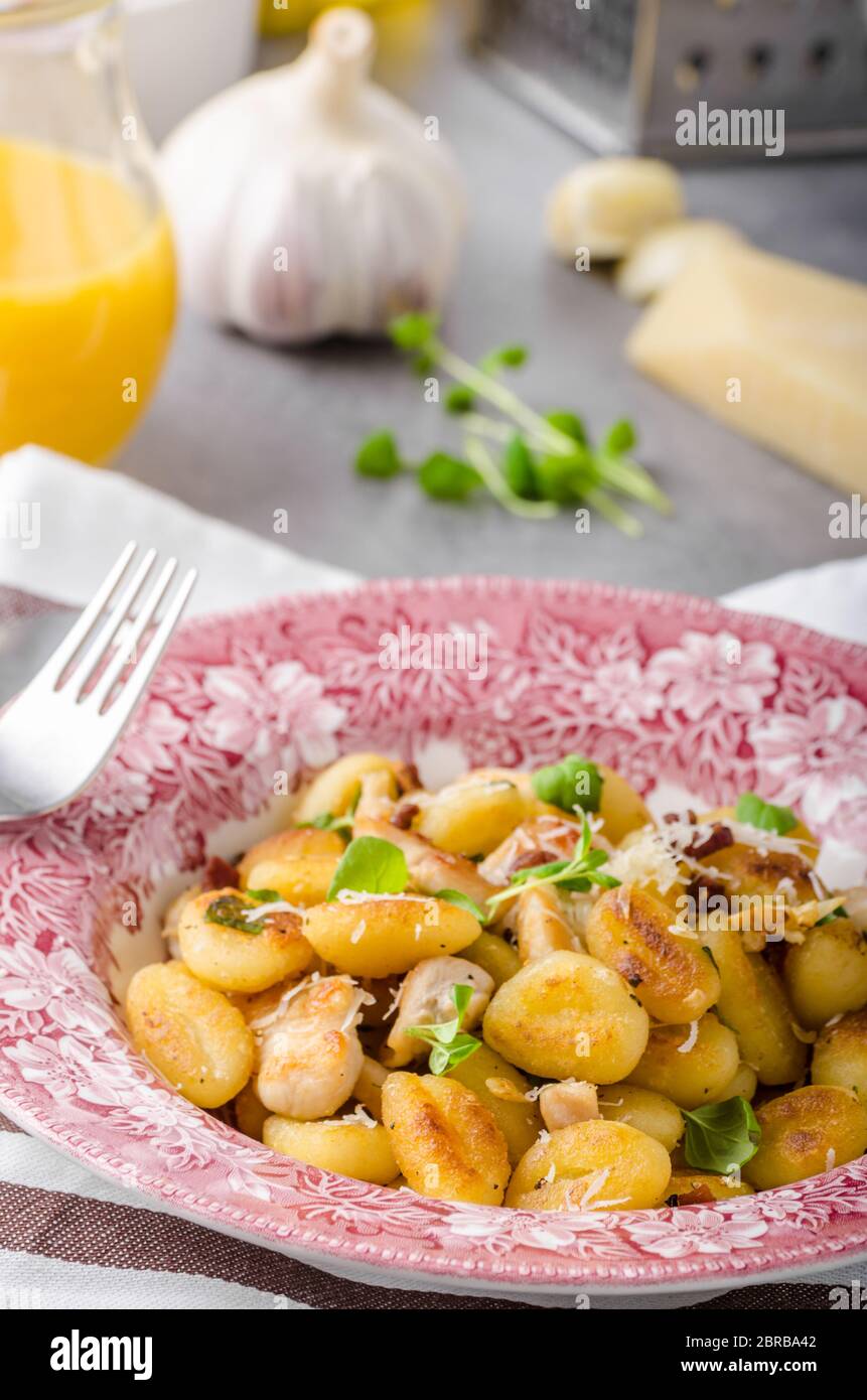 Roasted gnocchi with chicken, garlic and herbs, olive oil and parmesan