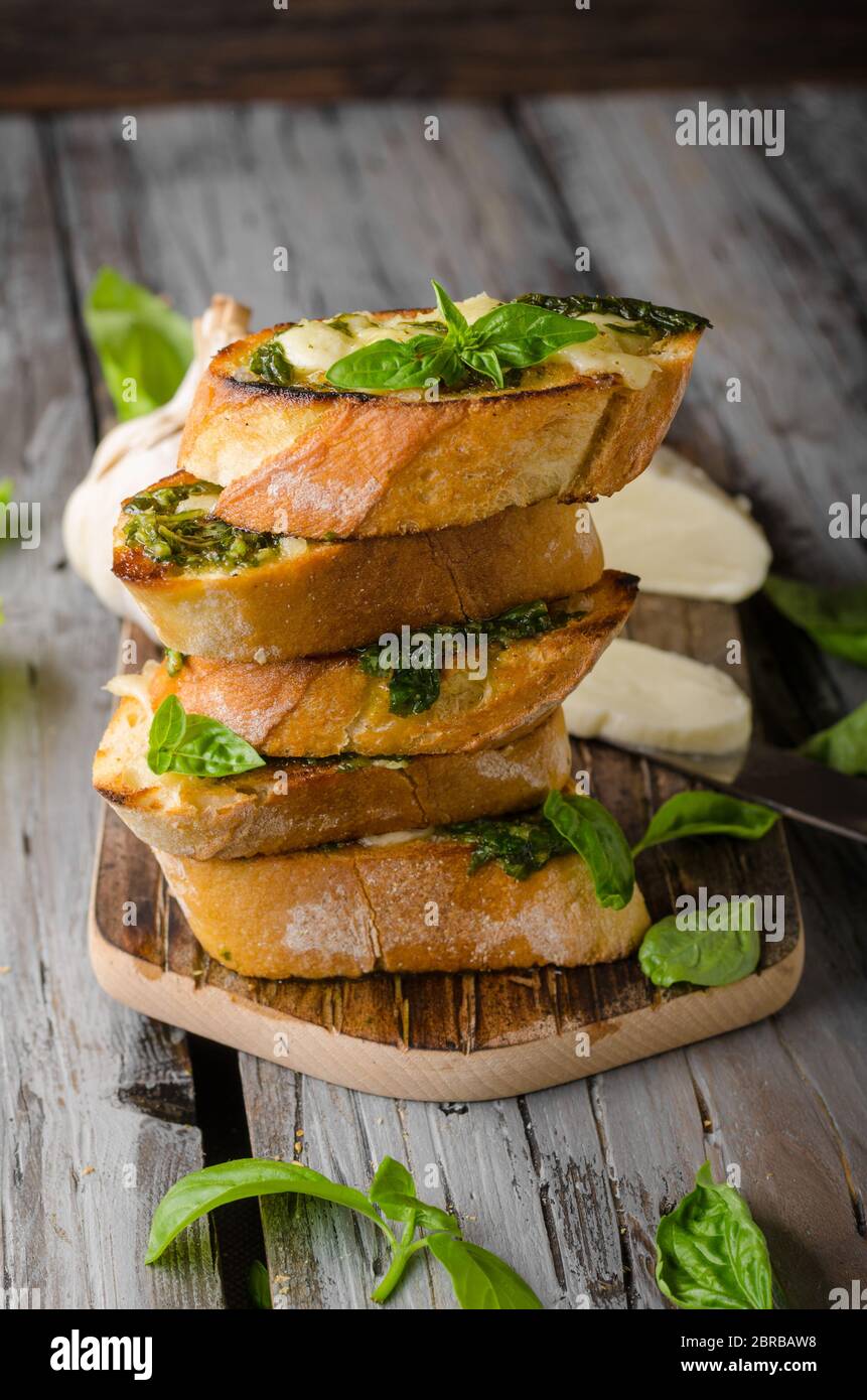 Garlic herbs toast with fresh mozzarella, food photography, vintage photography Stock Photo