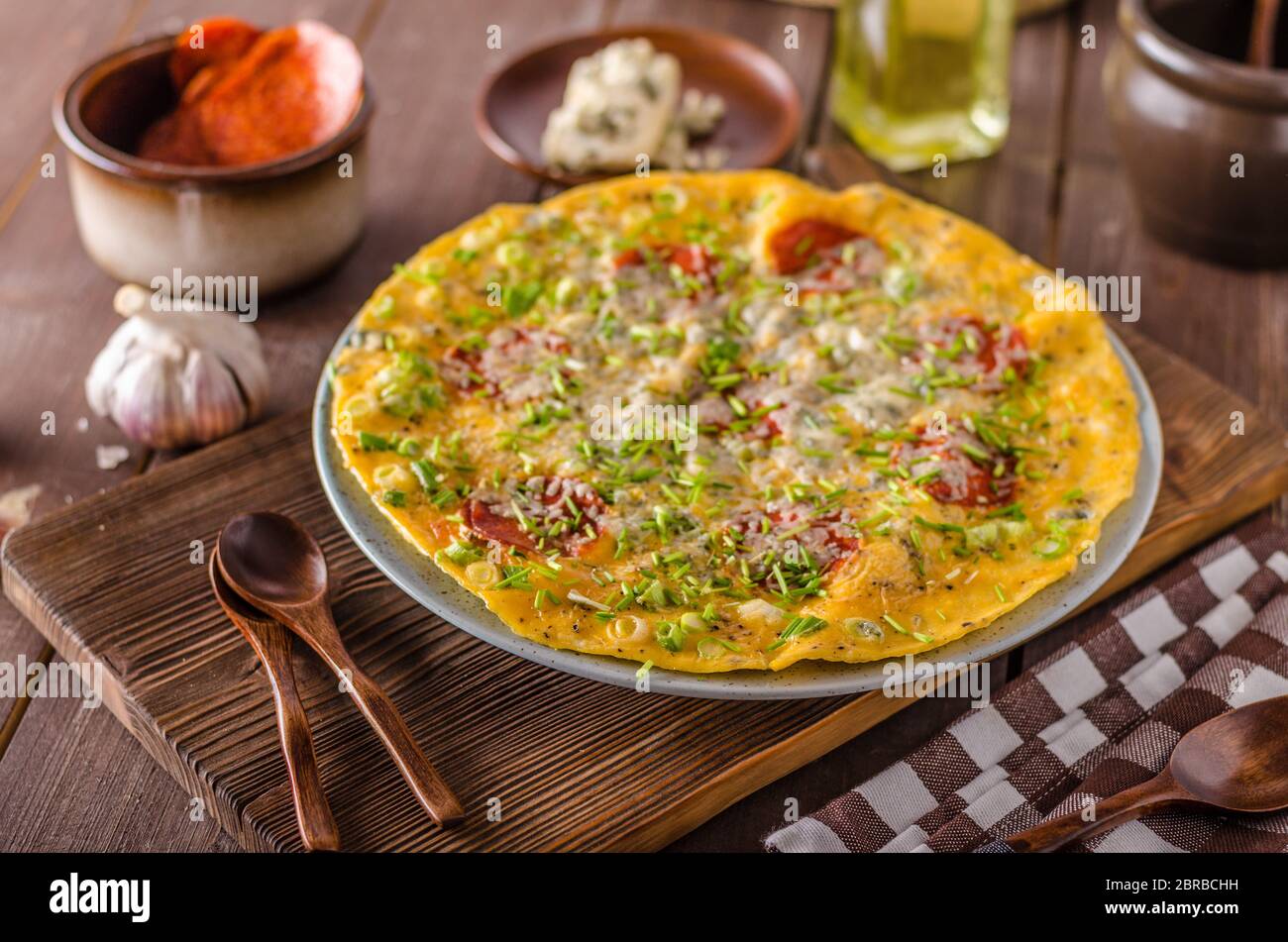 Salami blue cheese omelette, herbs and delish cheese inside Stock Photo