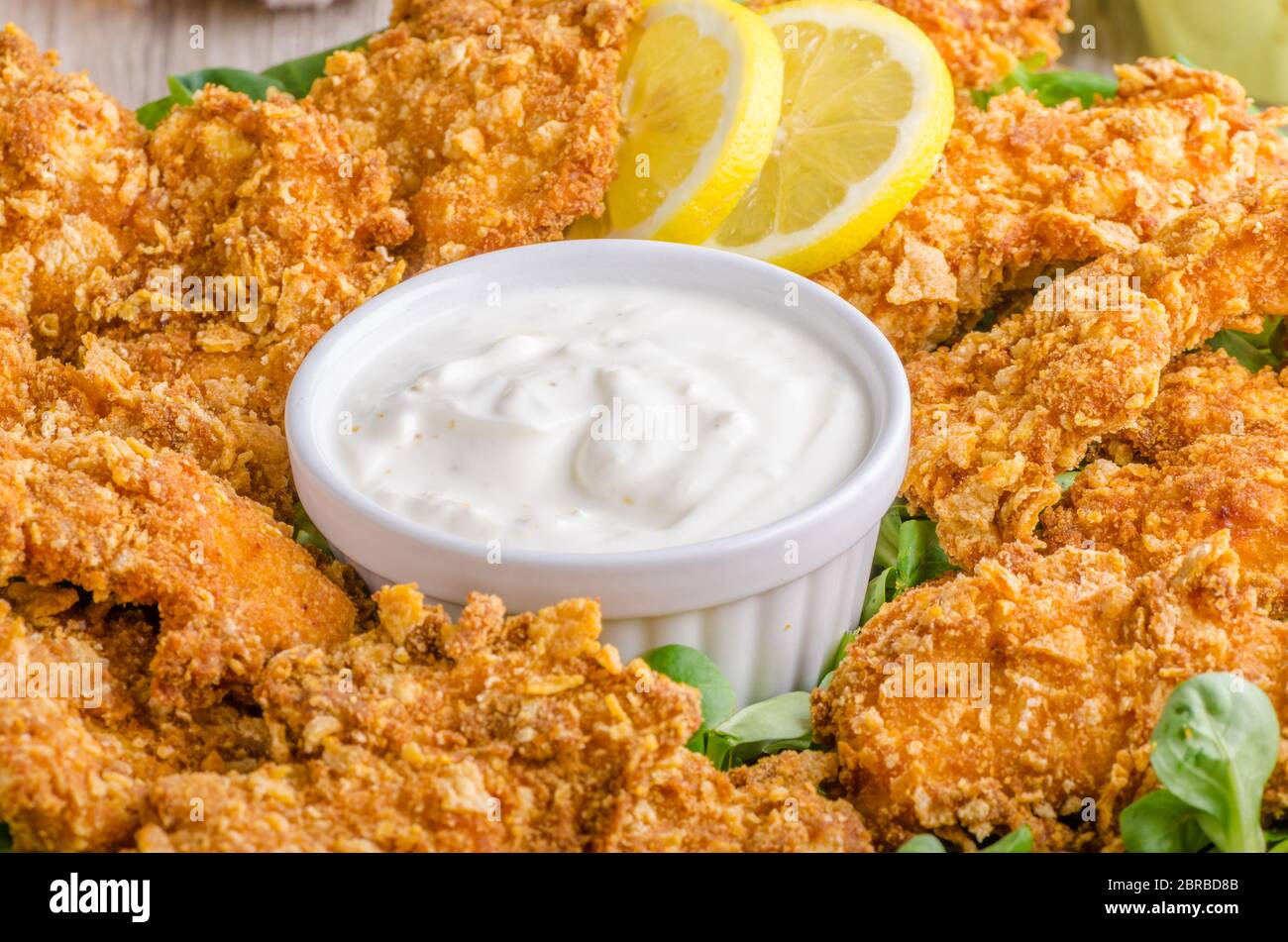 Chicken strips with delish garlic dip, food photography Stock Photo Alamy