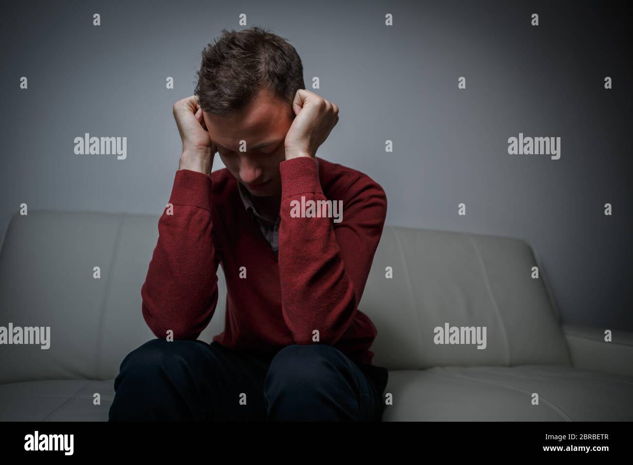 Depressed young man going through a rough patch in his life - suffering from mental exhaustion/anxiety/burnout/depression (color toned image) Stock Photo