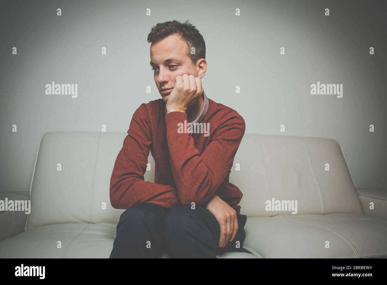 Depressed young man going through a rough patch in his life - suffering from mental exhaustion/anxiety/burnout/depression (color toned image) Stock Photo