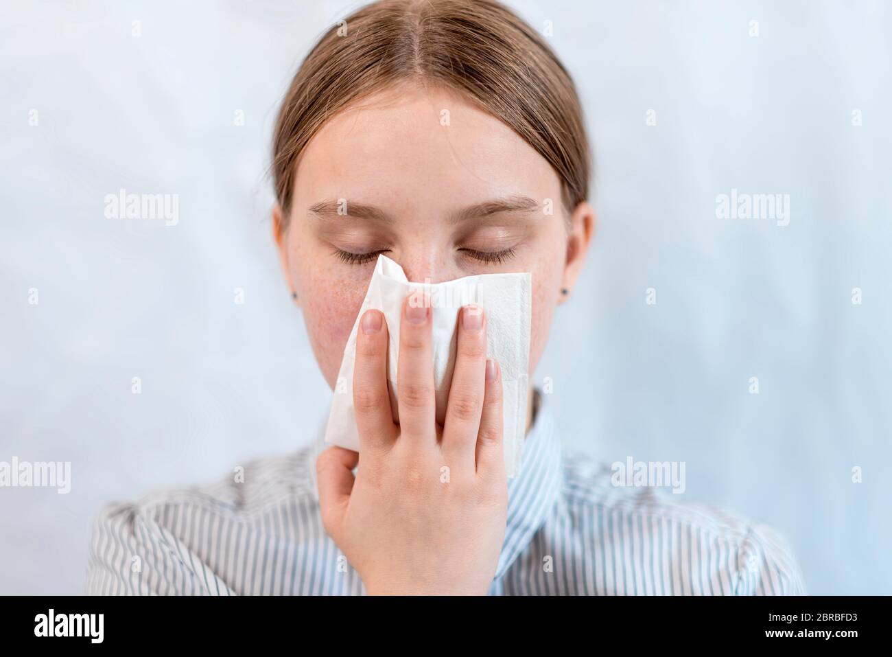 teenager girl, coughing up paper pulp, feeling unwell, sore throat