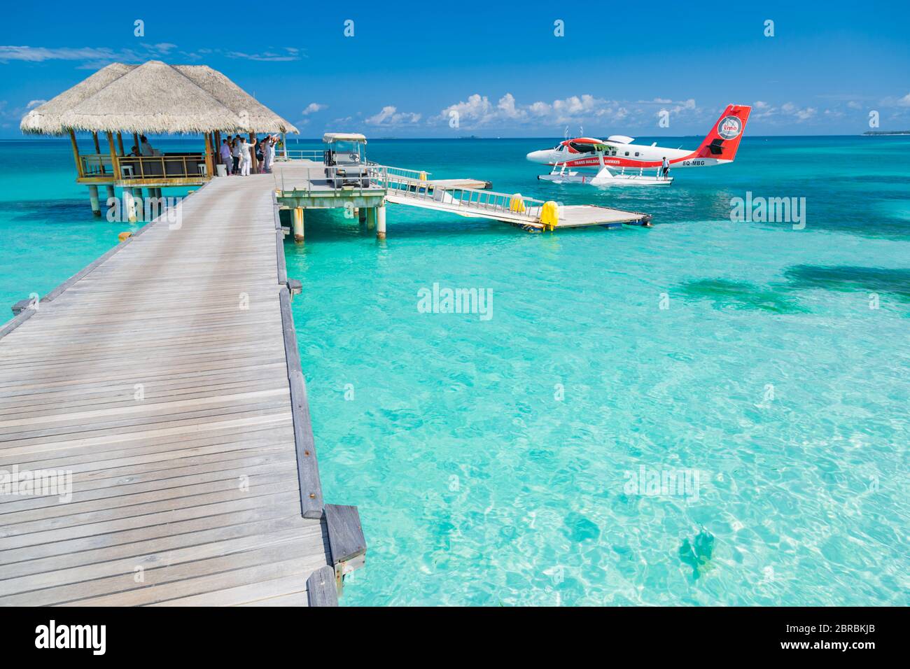 05.19.2019 - Ari Atoll, Maldives: Exotic scene with Trans Maldivian Airways seaplane on Maldives sea landing. Vacation or holiday in Maldives concept Stock Photo
