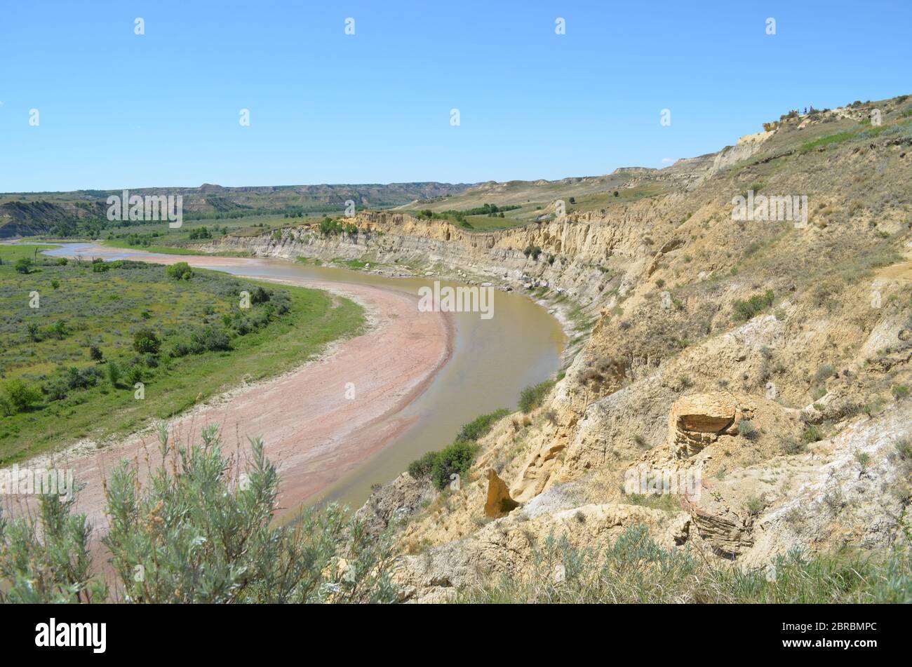 Spring in the North Dakota Badlands: Looking Downstream Toward Jules Creek on the Little Missouri River in Theodore Roosevelt National Park South Unit Stock Photo