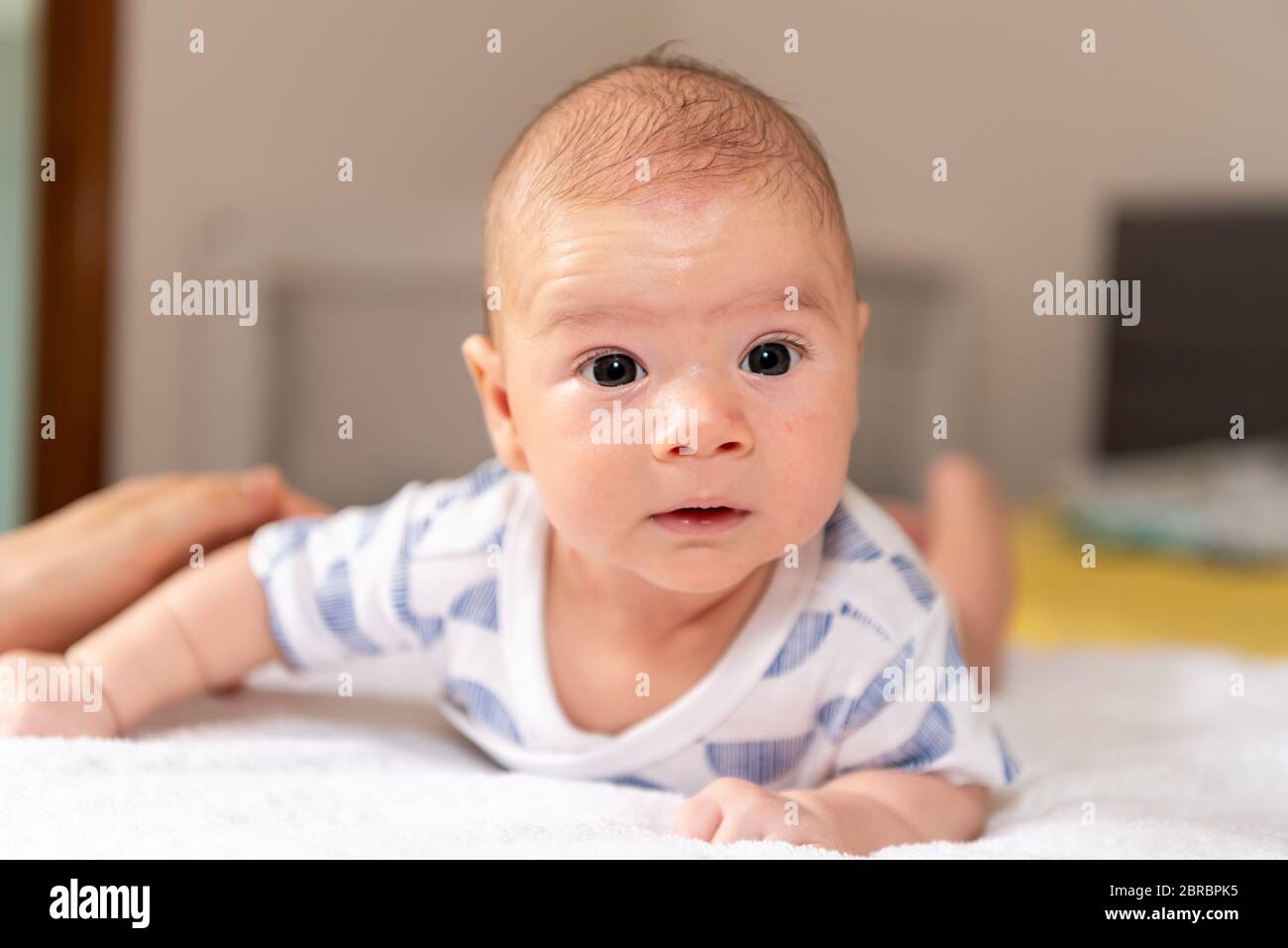 Adorable little baby boy during tummy time Stock Photo