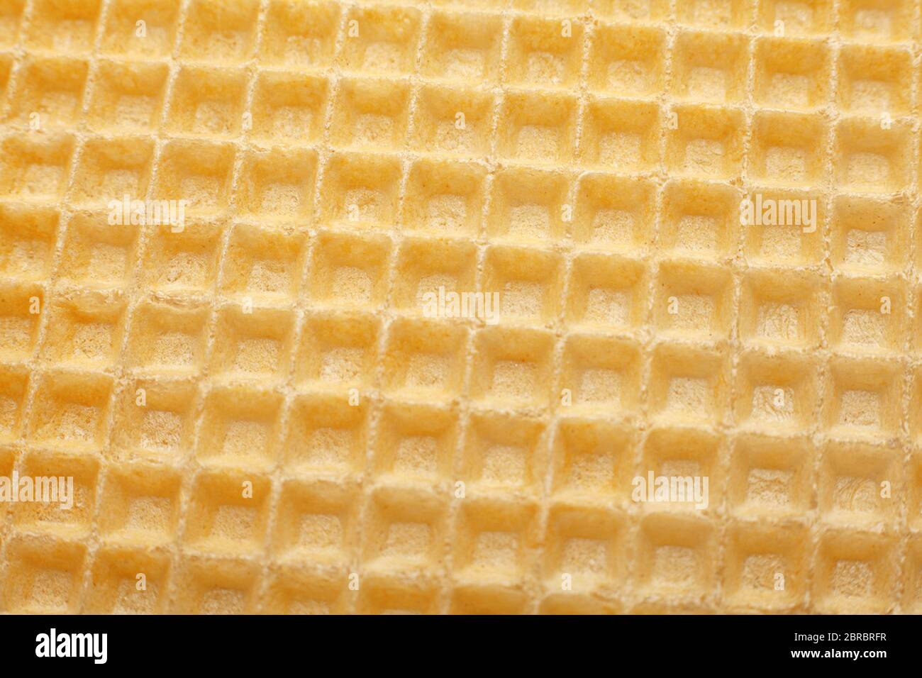 Yellow waffles surface closeup detail background Stock Photo