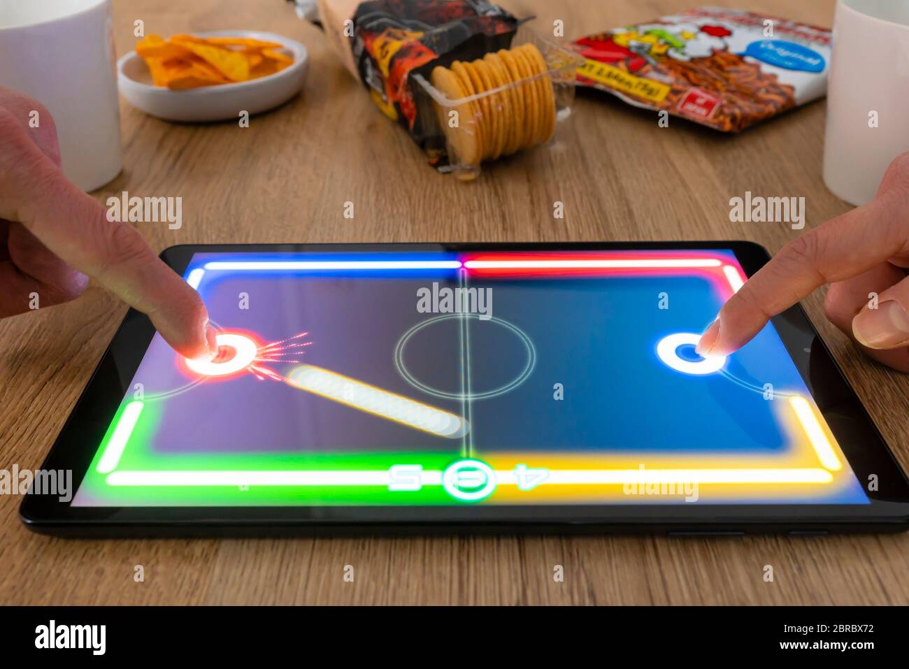 Playing hockey game on an android tablet Stock Photo