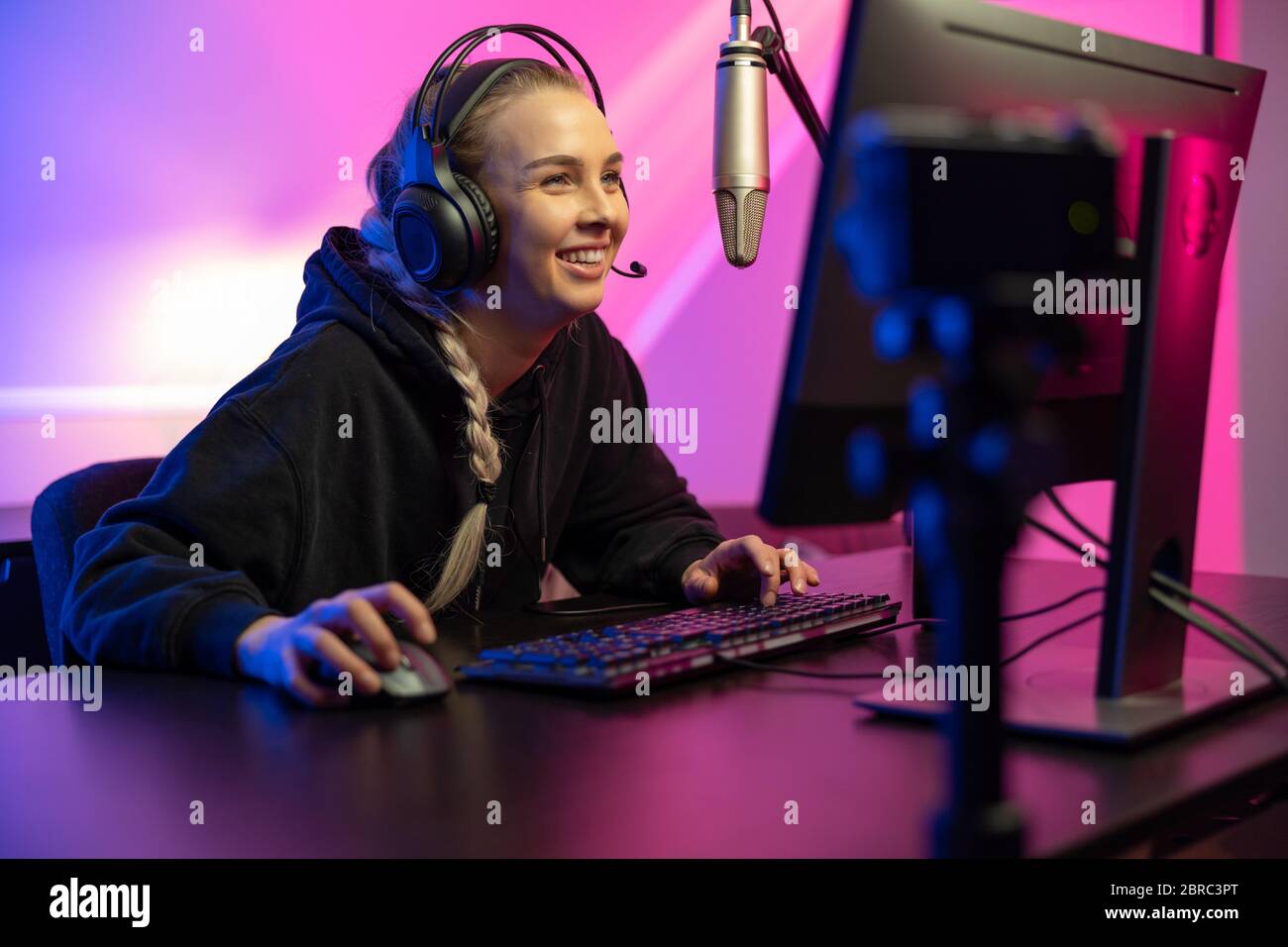 Happy Pretty Blonde Gamer Girl Playing Online Video Game on Her Personal  Computer Stock Photo - Alamy