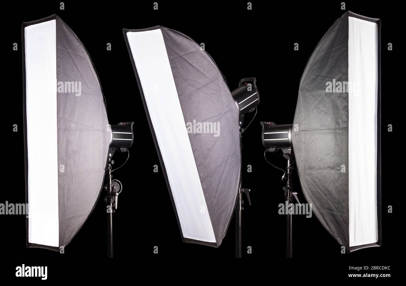 Set of photography studio flash with softbox isolated on black