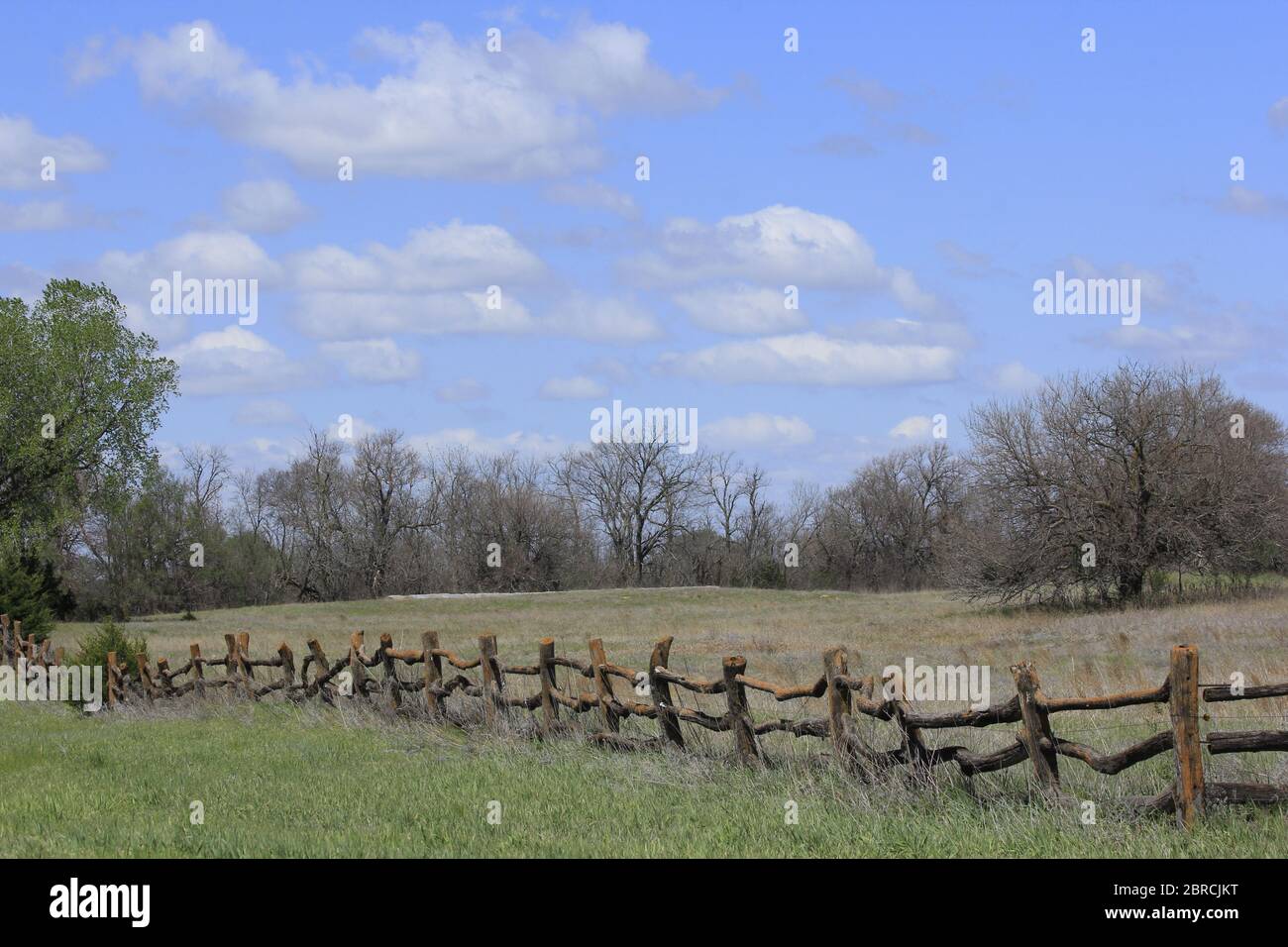 Kansas Country wooden fence with tree's,blue sky and white cloud's ...