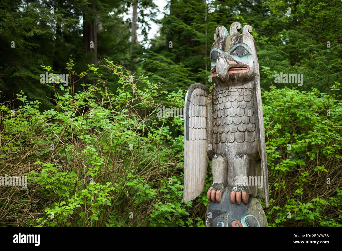 Totem Bight State Historical Park, Ketchikan, Alaska, USA, displays replica and restored Native American totem poles like Thunderbird and whale. Stock Photo