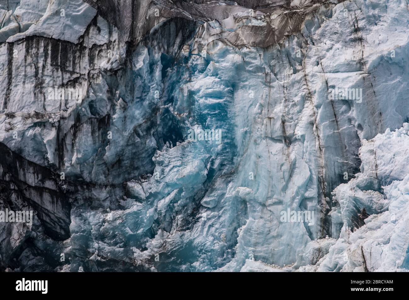 Sawyer Glacier, Tracy Arm Fjord, Southeast Alaska, is an active tidewater glacier appreciated by tourists on small ship cruises and boat tours. Stock Photo
