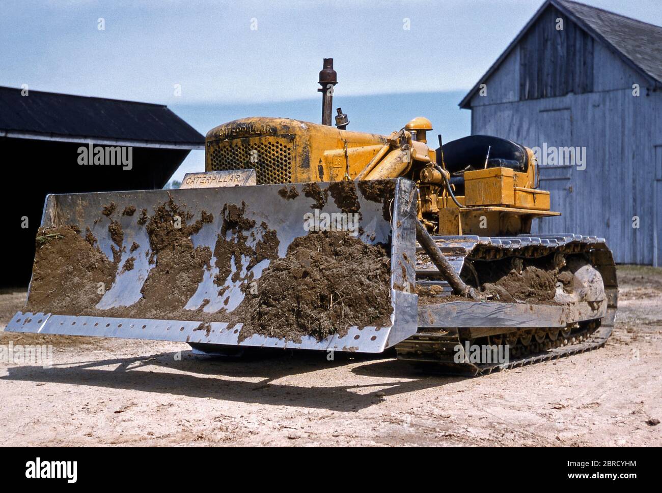 A Caterpillar D6 track-type diesel tractor used on a family farm for land clearance, USA in the early 1950s. Stock Photo