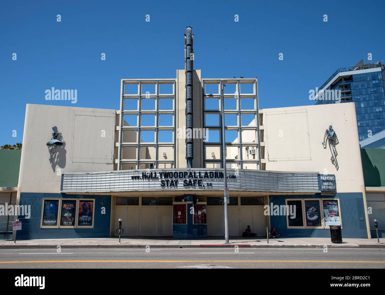Hollywood, CA/USA - May 4, 2020: The Hollywood Palladium Theatre, a historic landmark, is deserted except for homeless people during coronavirus quara Stock Photo