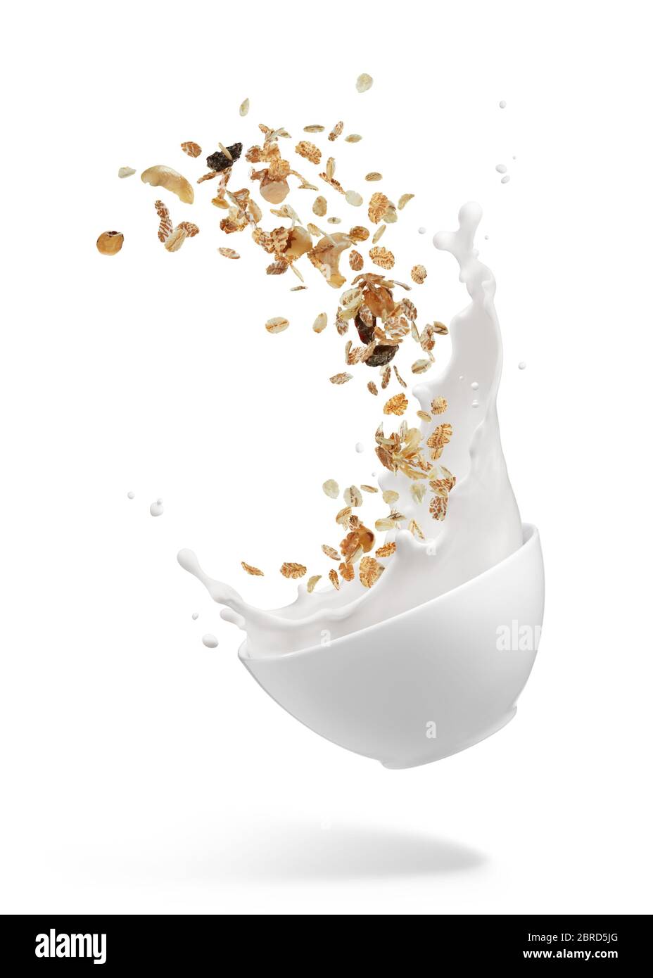 bowl of muesli with milk splashing isolated on white Stock Photo