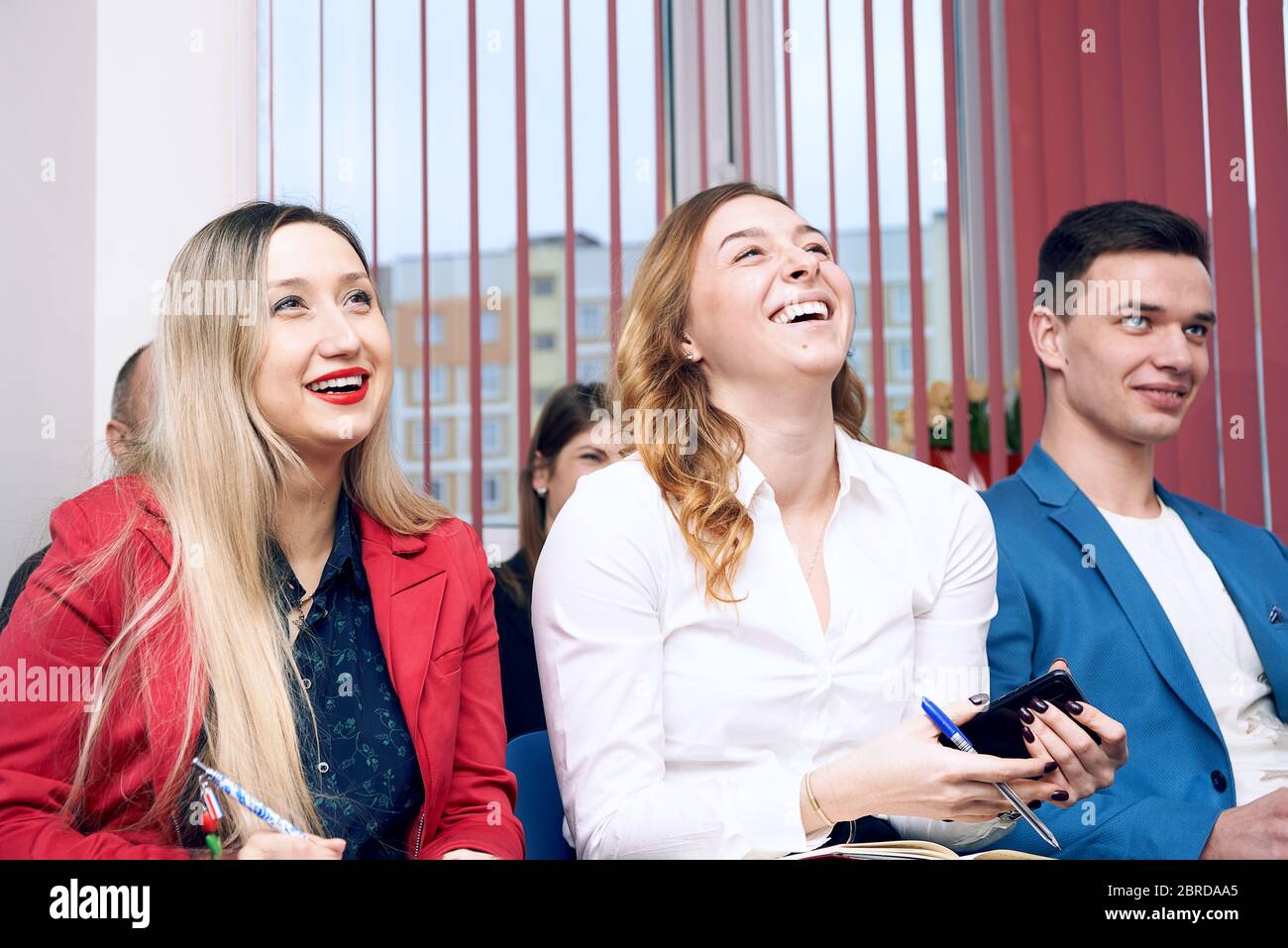 happy office workers managers laughing at meeting Stock Photo