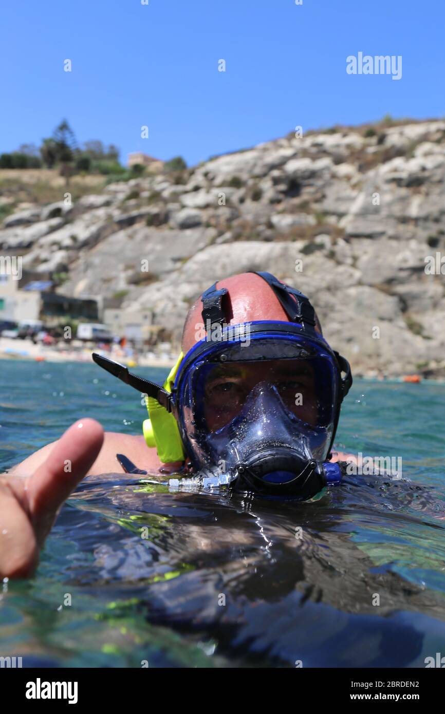 Scuba Diver with Full Face Mask Stock Photo