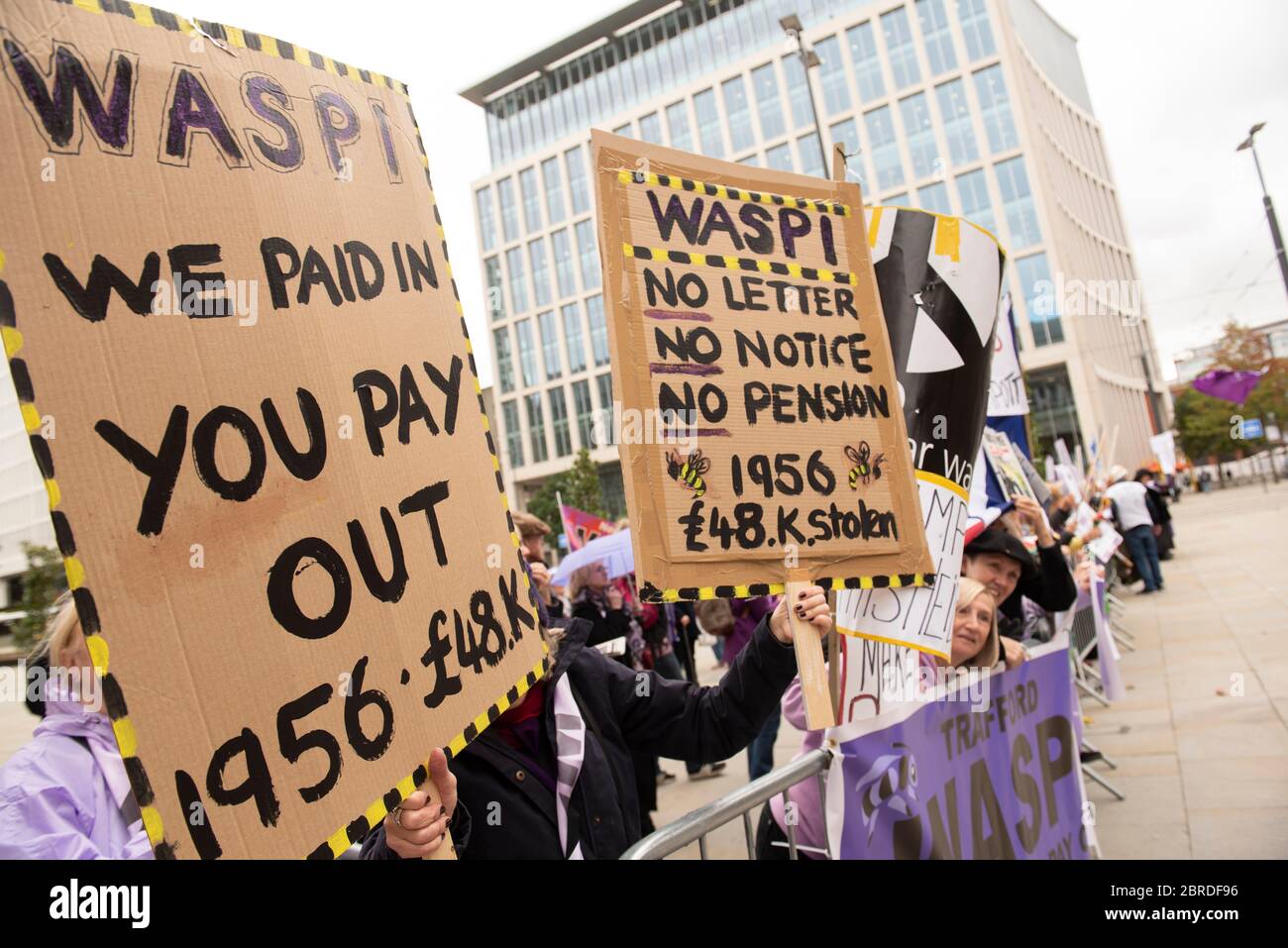 WASPI protestors hold banners and placards asking for equal pension rights for women - Women Against State Pension Inequality Stock Photo