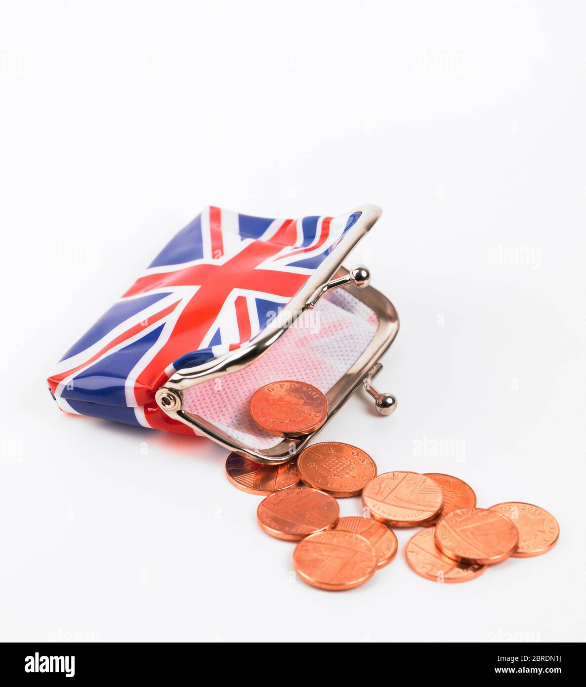 Pennies and opened Union Jack purse on white background Stock Photo